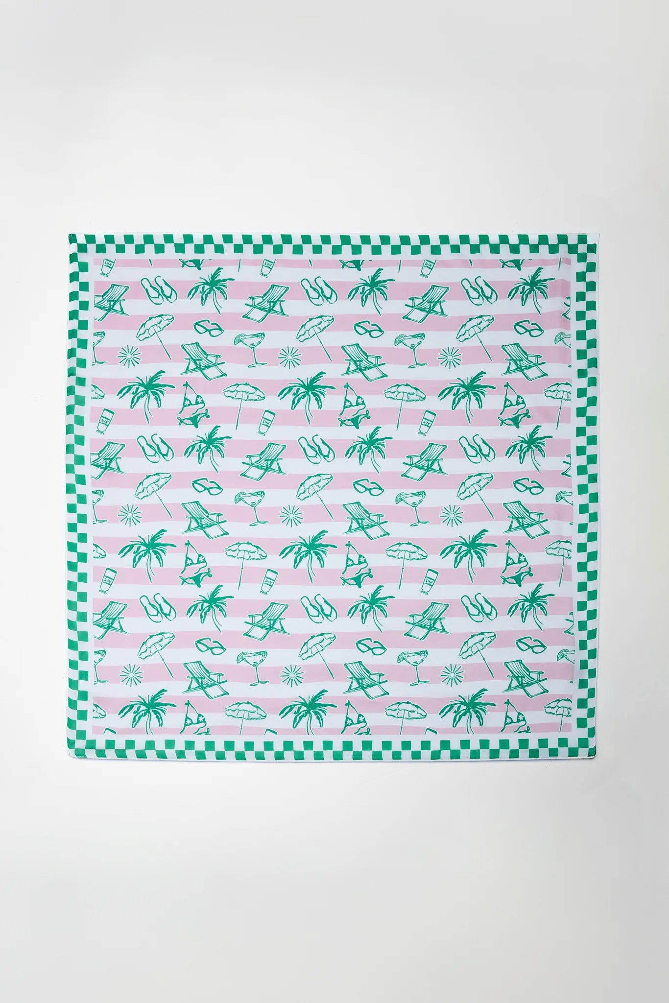 Patterned fabric with green and pink design on a white background