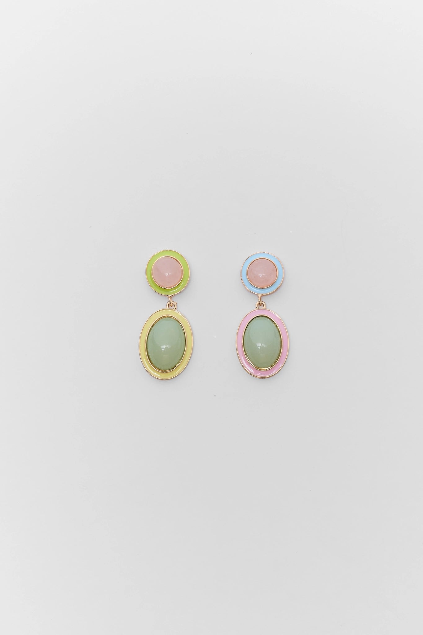 Pair of colorful earrings on a light gray background