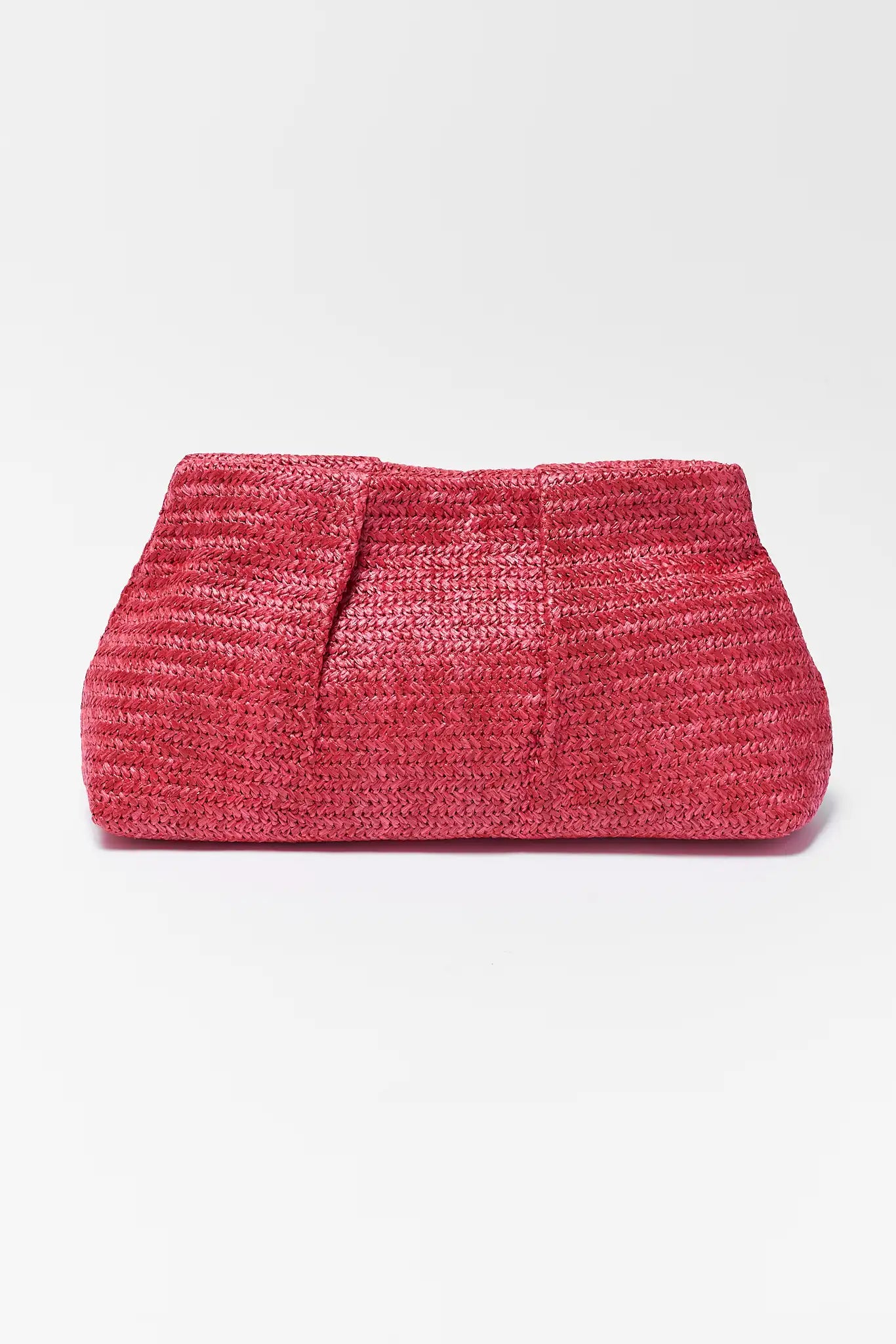 Pink woven clutch bag on a background
