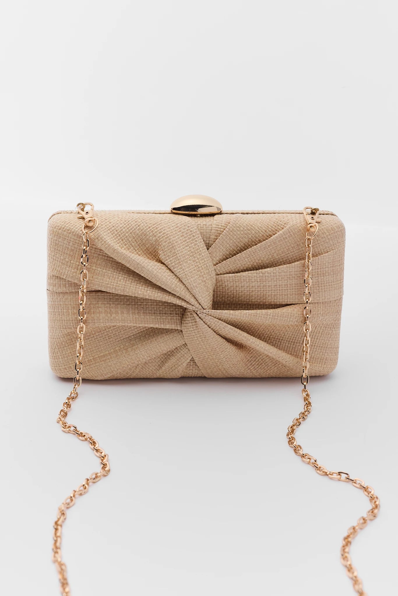 Beige clutch bag with a gold chain on a white background