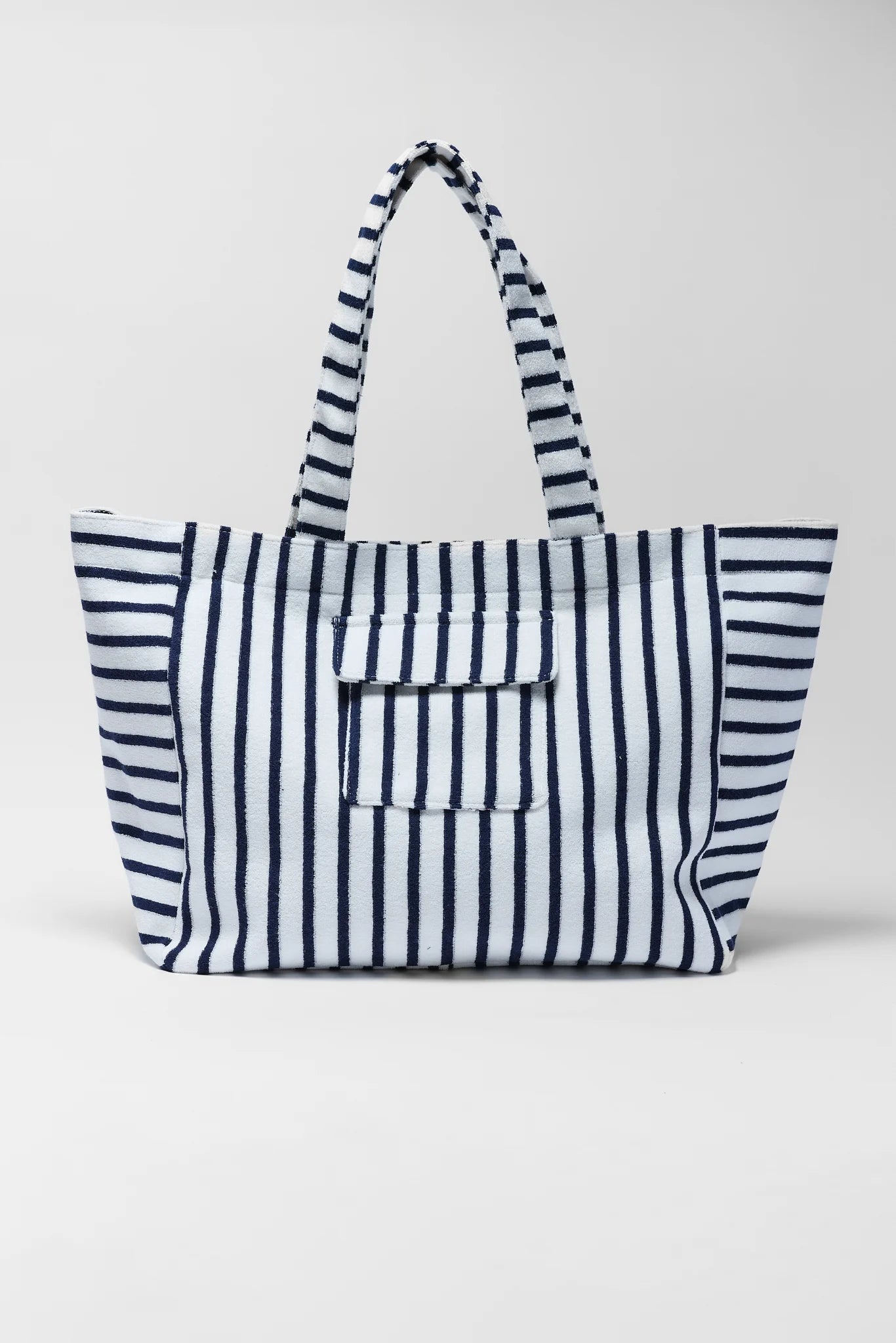 Navy and white striped tote bag on a light gray background
