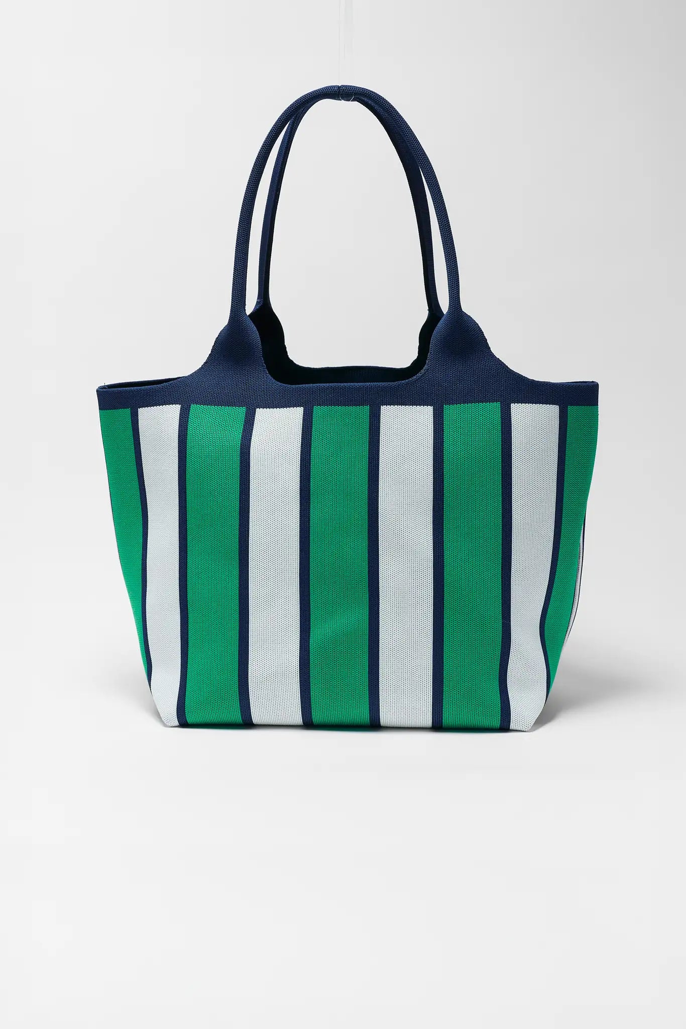 Striped tote bag with green, white, and navy pattern on a white background
