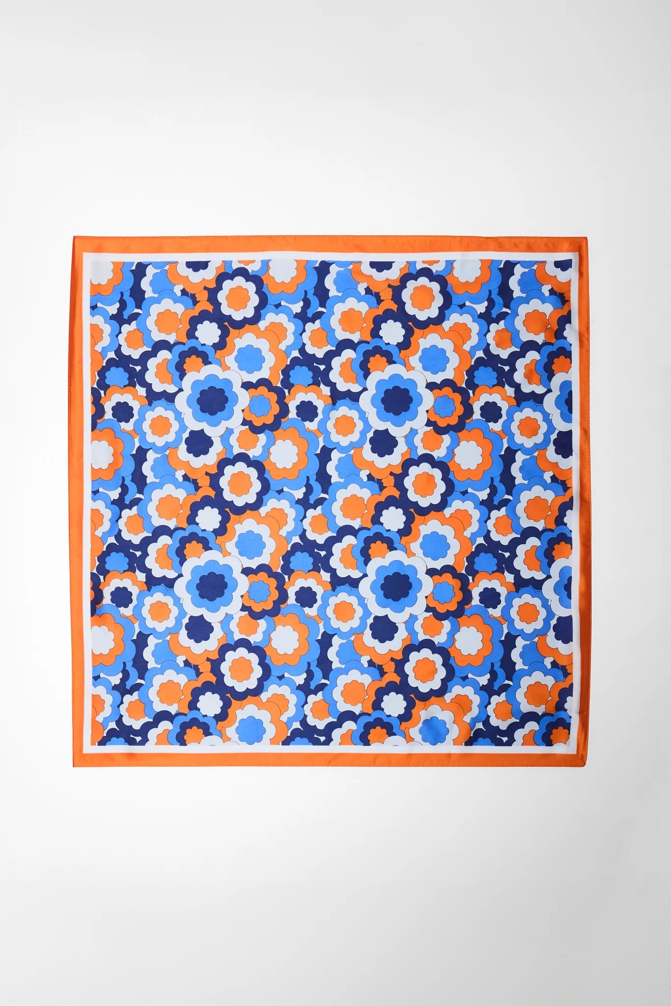 Square fabric with blue and orange floral pattern on a white background
