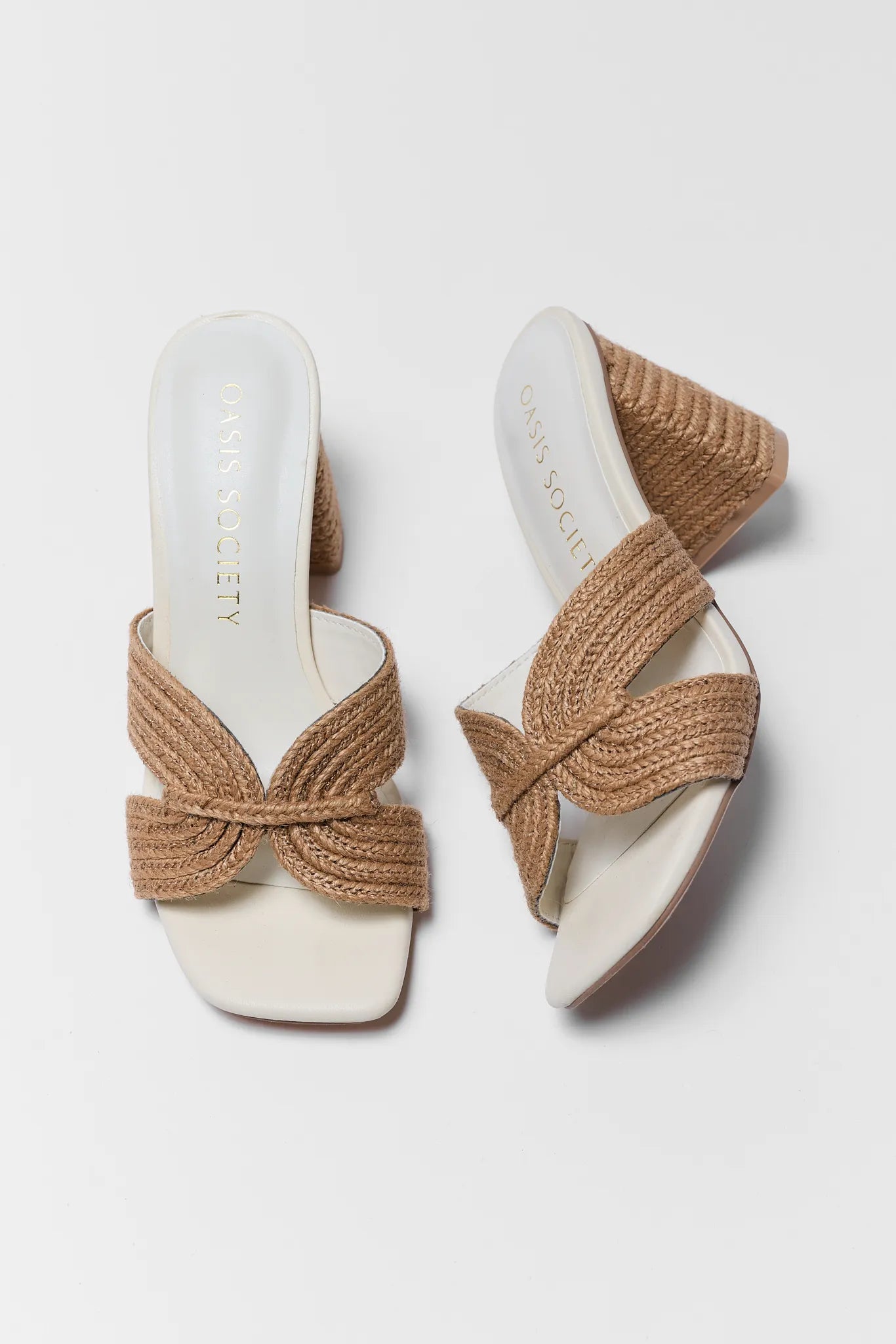 Pair of sandals with woven straps on a white background