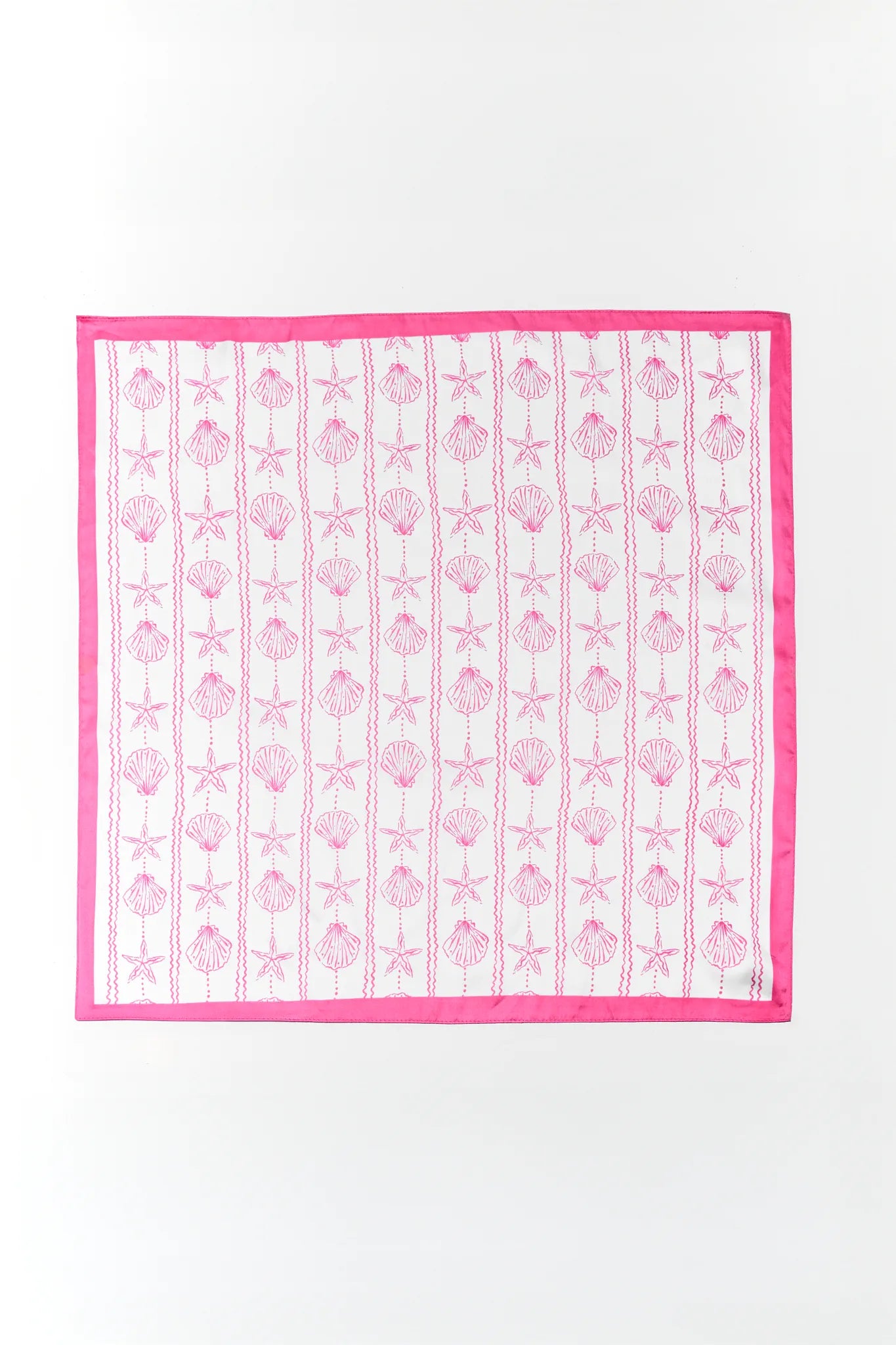 pink sheila shell scarf on plain background