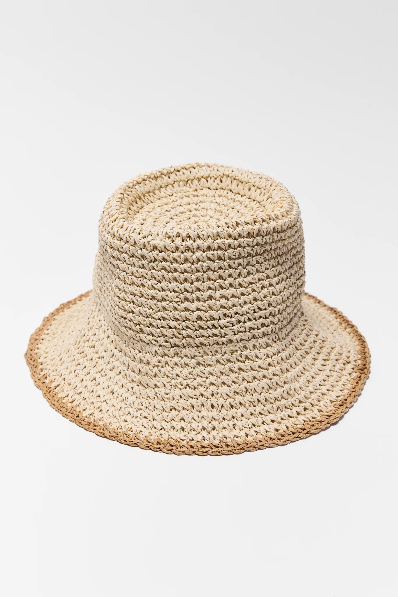 Beige woven hat on a light gray background