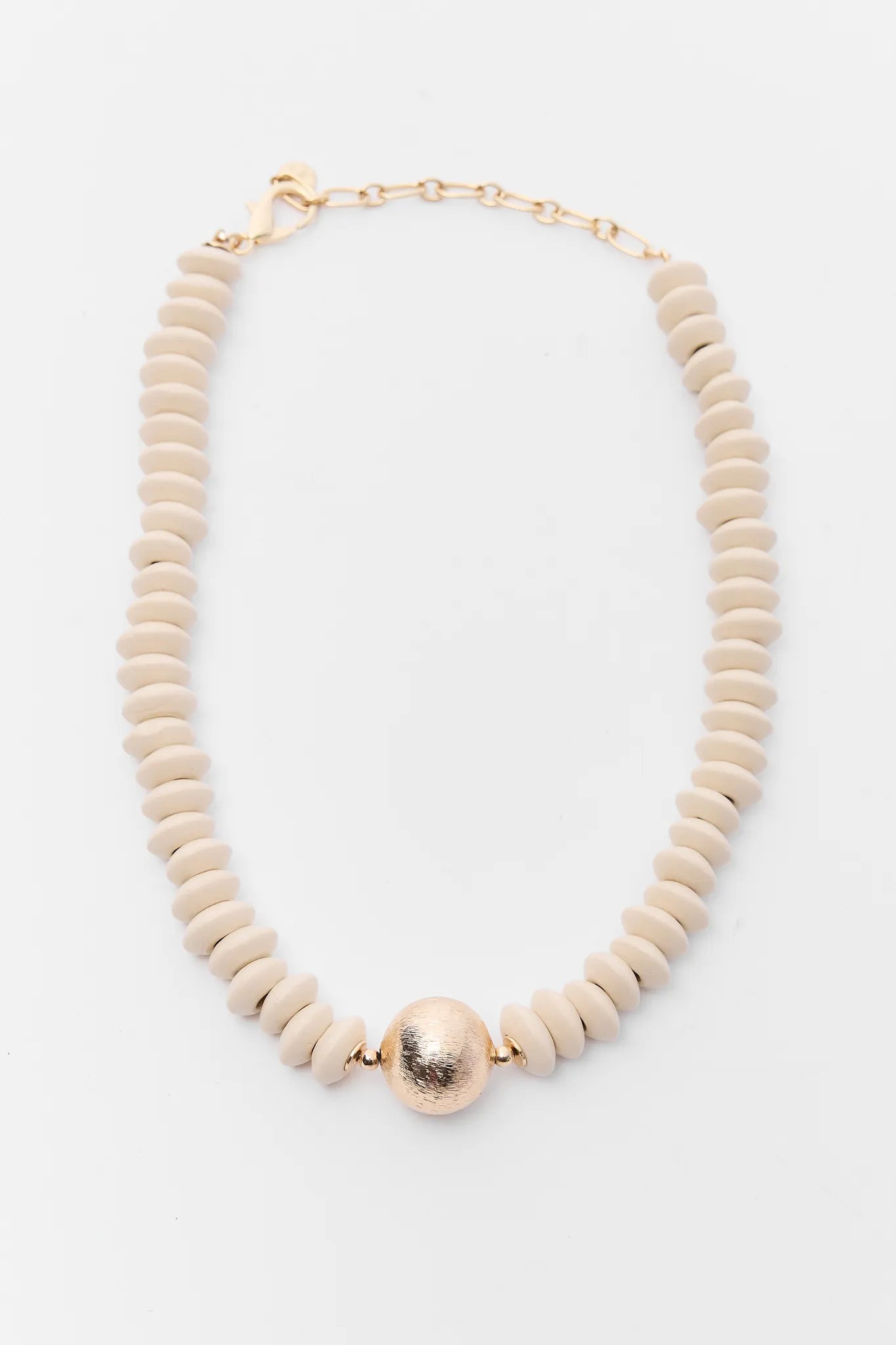 Necklace with beige beads and a gold clasp on a white background
