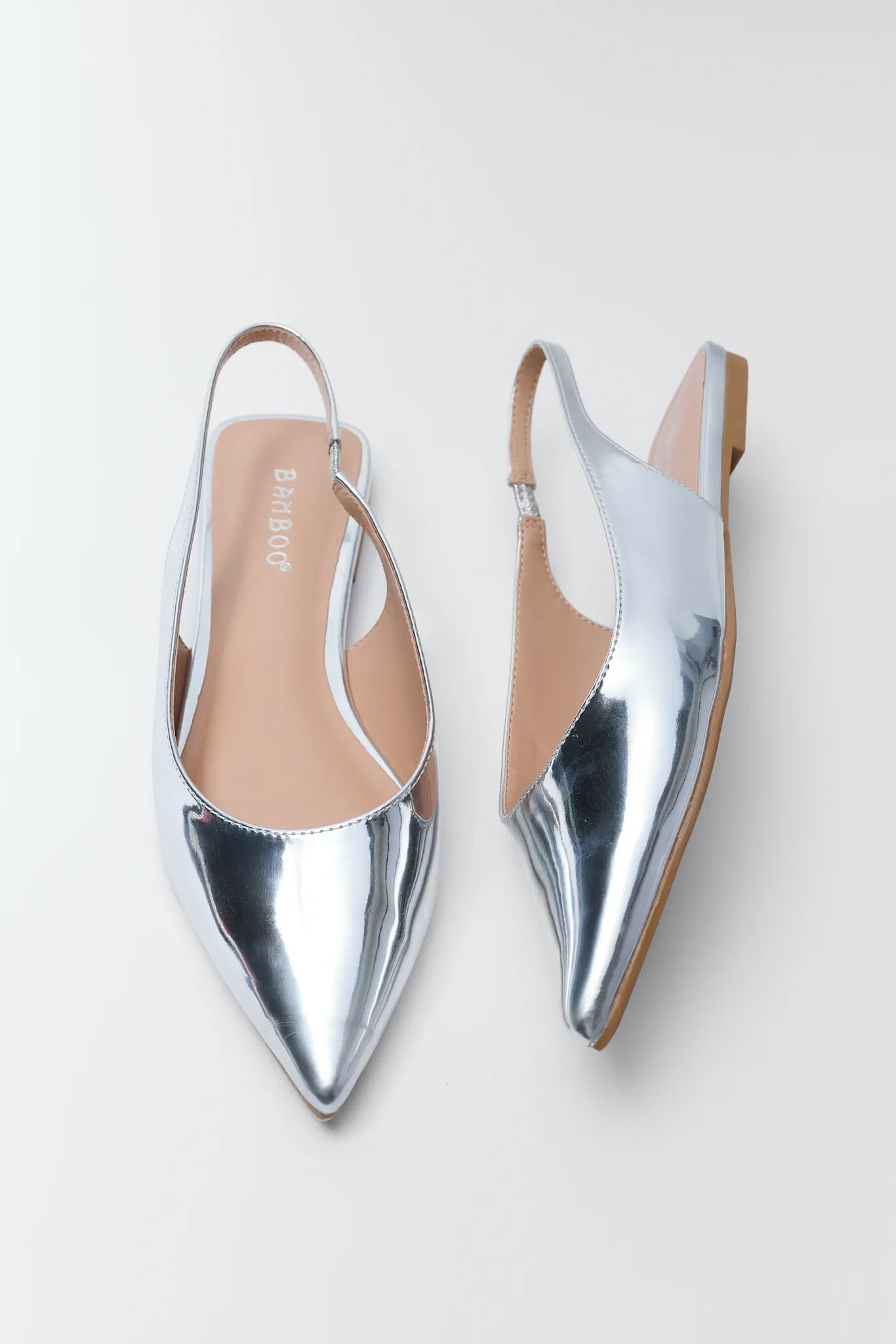 Sylvia Silver Metallic Flats on a white background