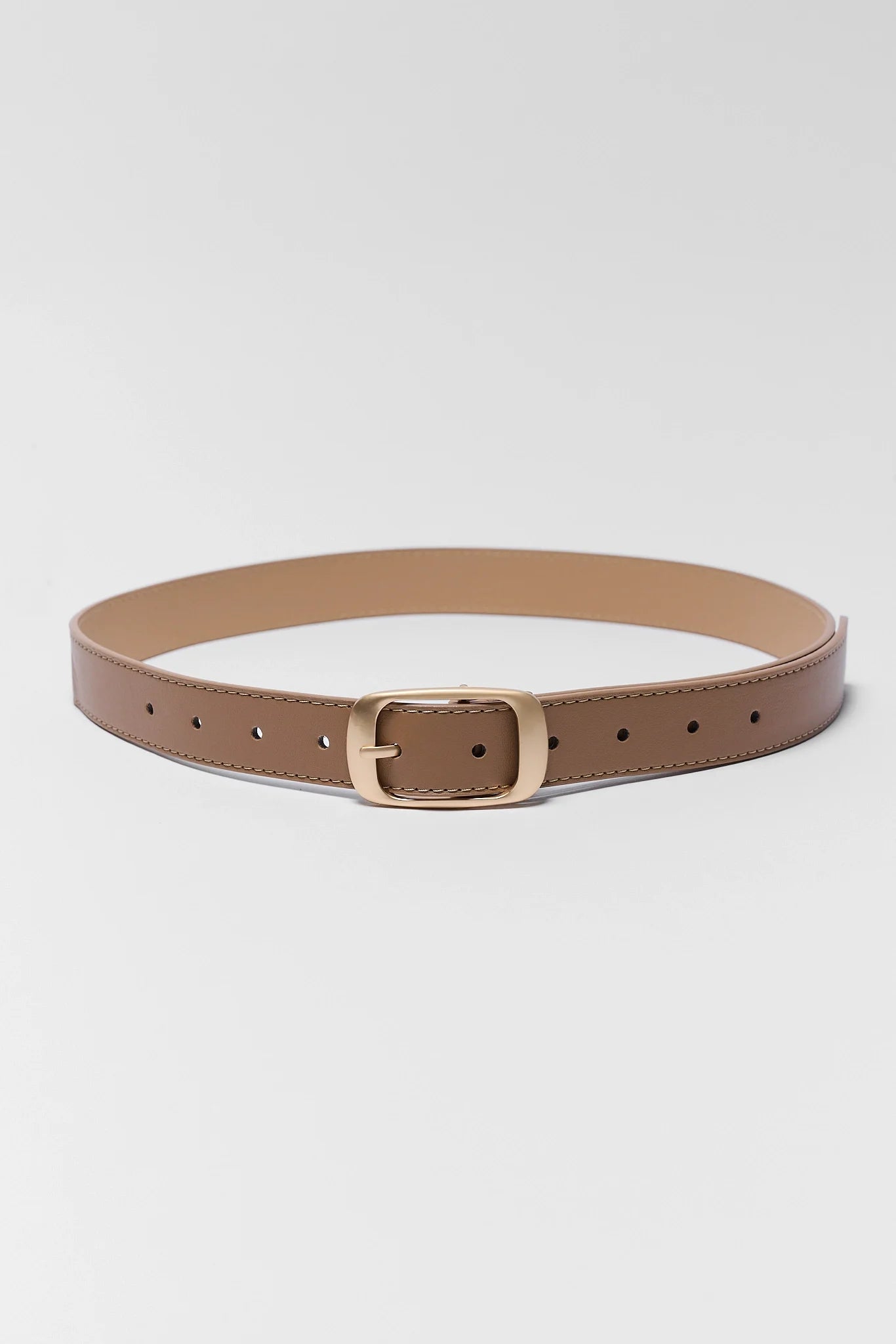 A slim brown leather belt with a gold-tone metal buckle, displayed in a curved shape on a light gray background.
