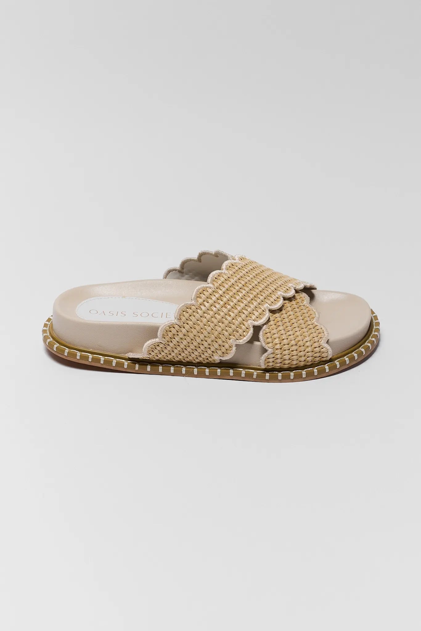 one Beige sandal with woven strap on a light gray background