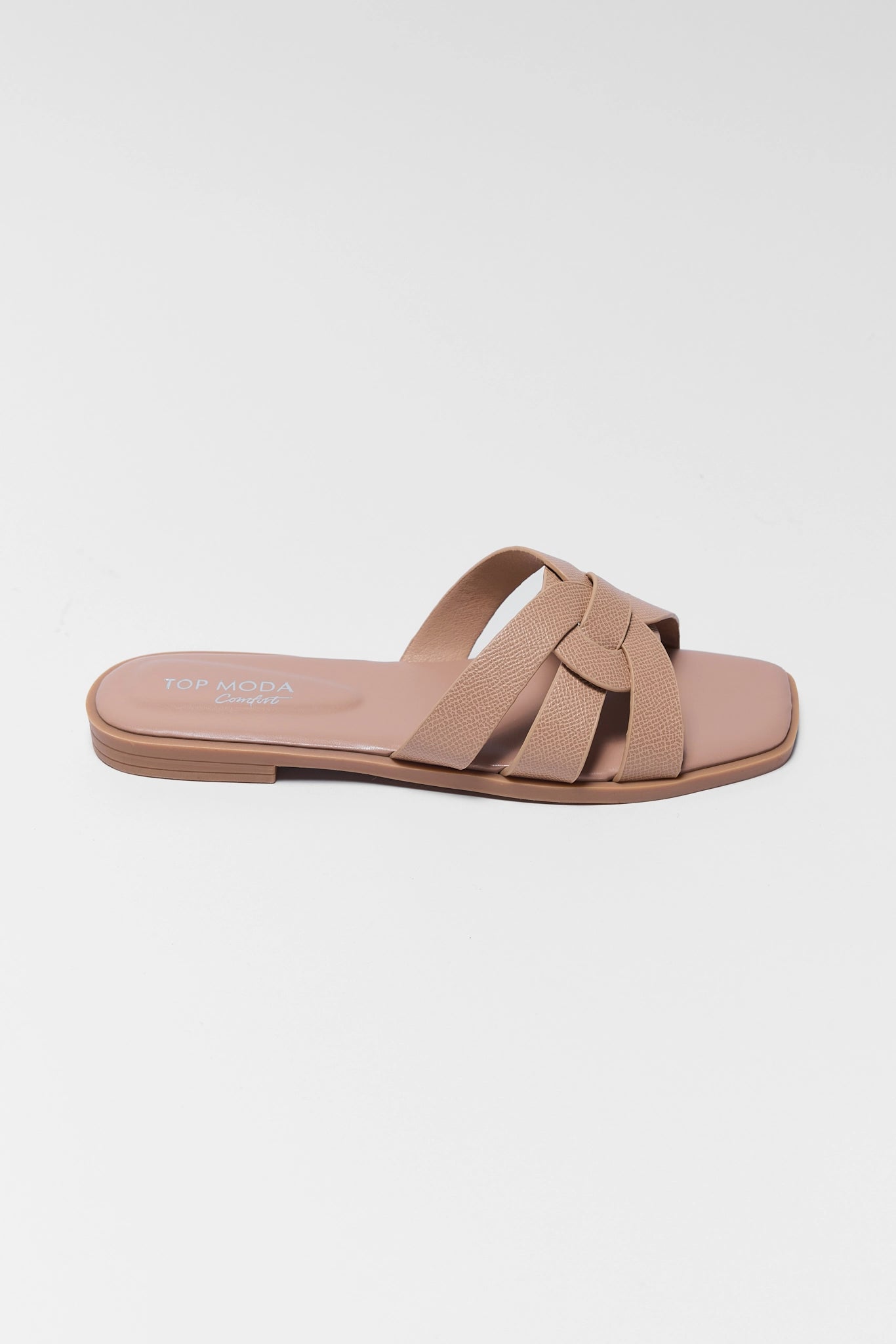 Beige sandal with a strap on a white background