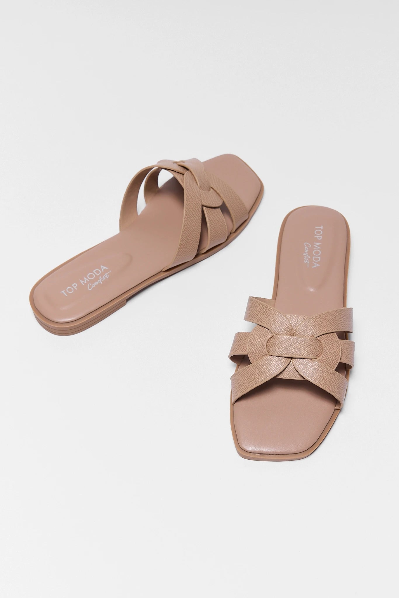 two tan slip on sandals
