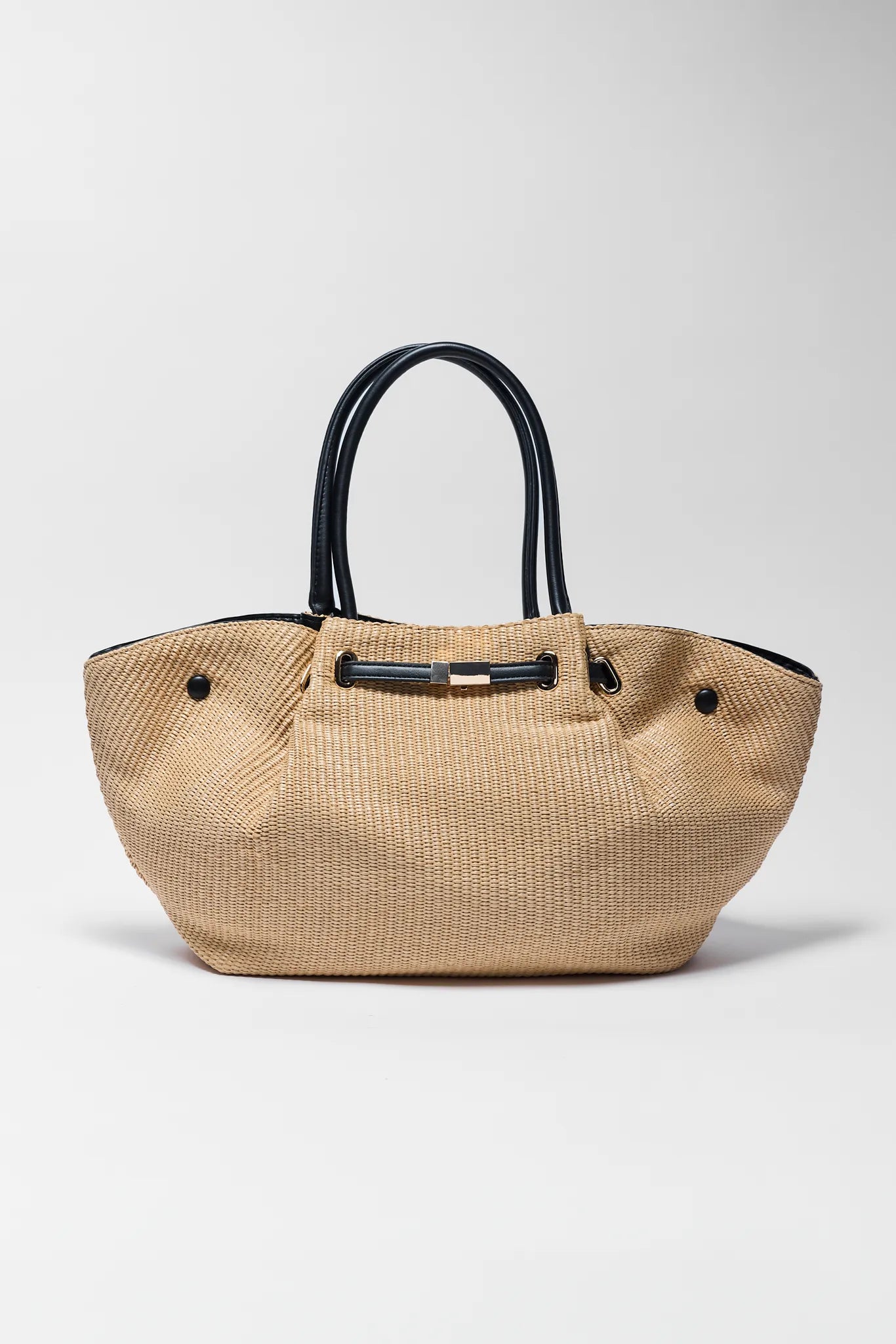 Beige handbag with black handles on a white background