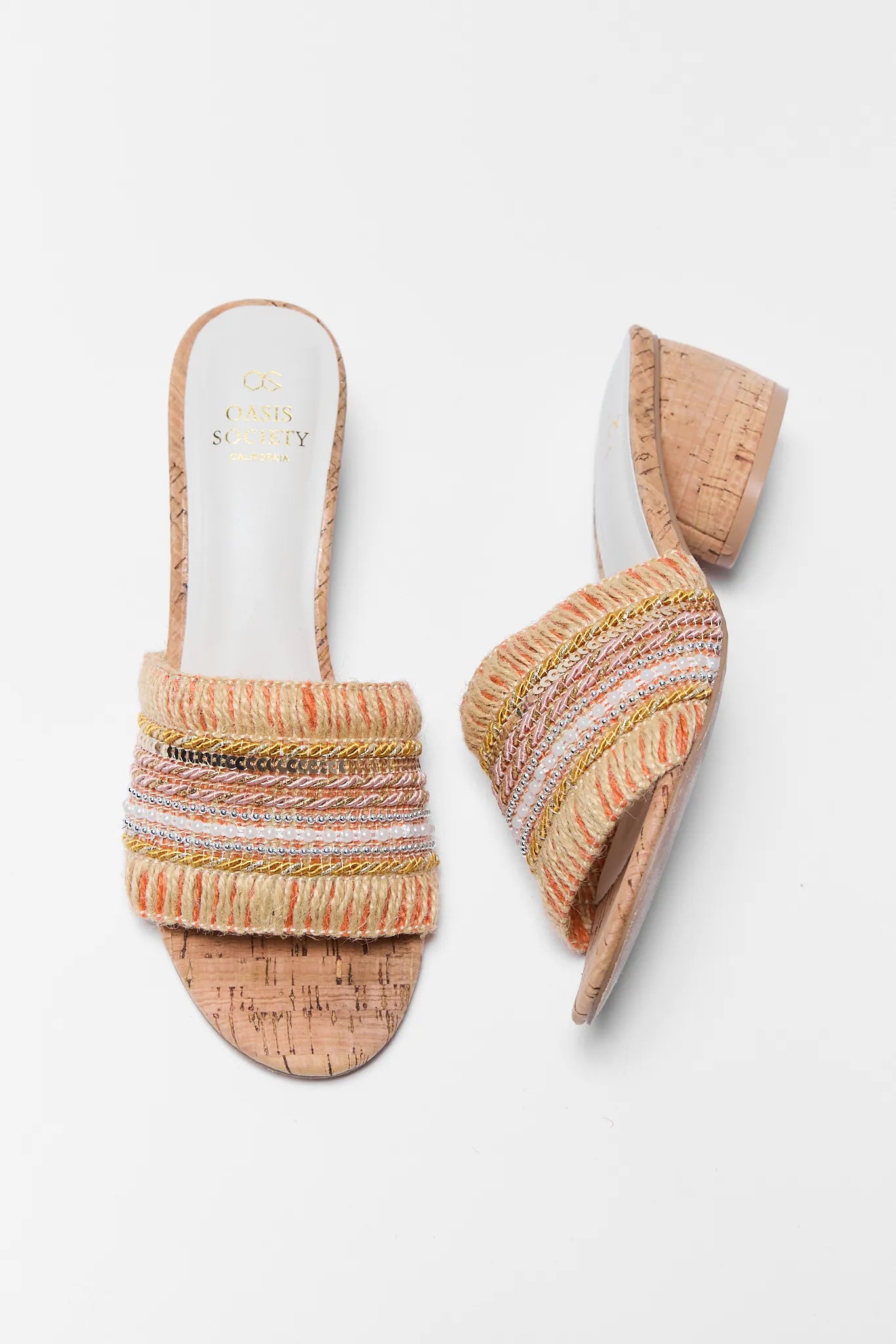 Pair of multicolored woven sandals on a white background