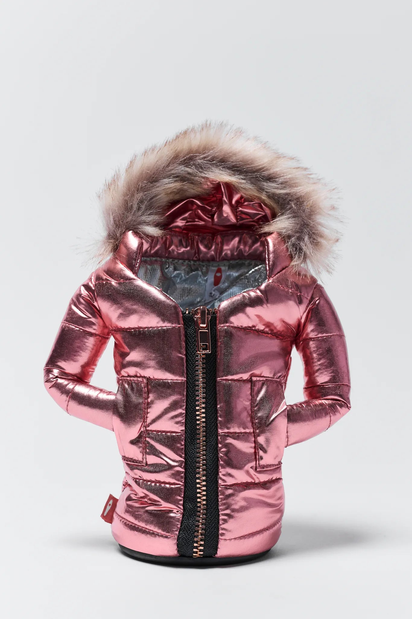 Pink metallic jacket with fur hood on a light gray background