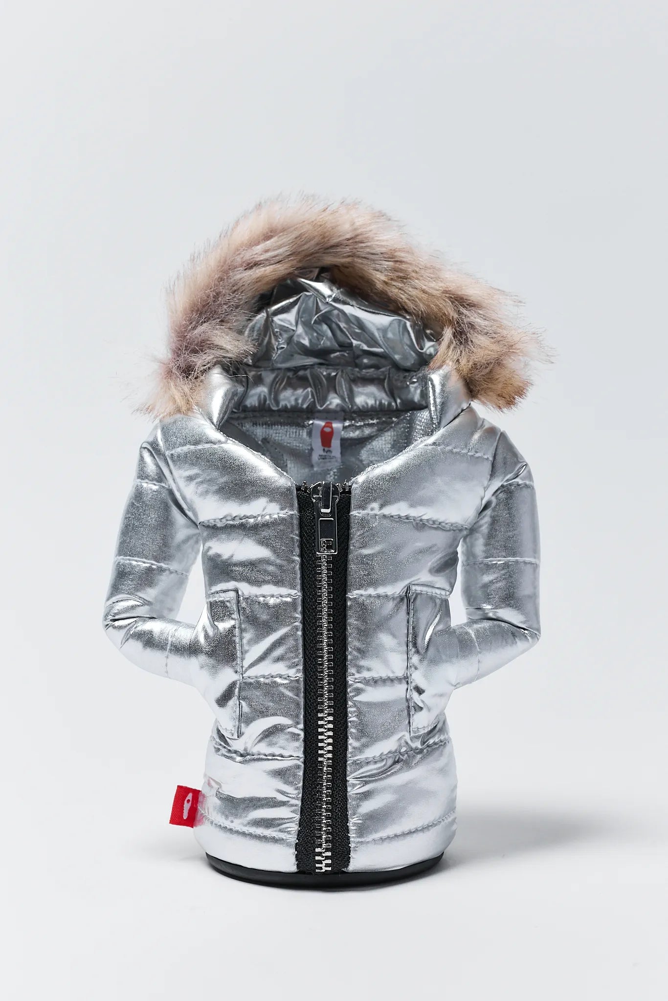 Silver metallic jacket with fur hood on a light gray background