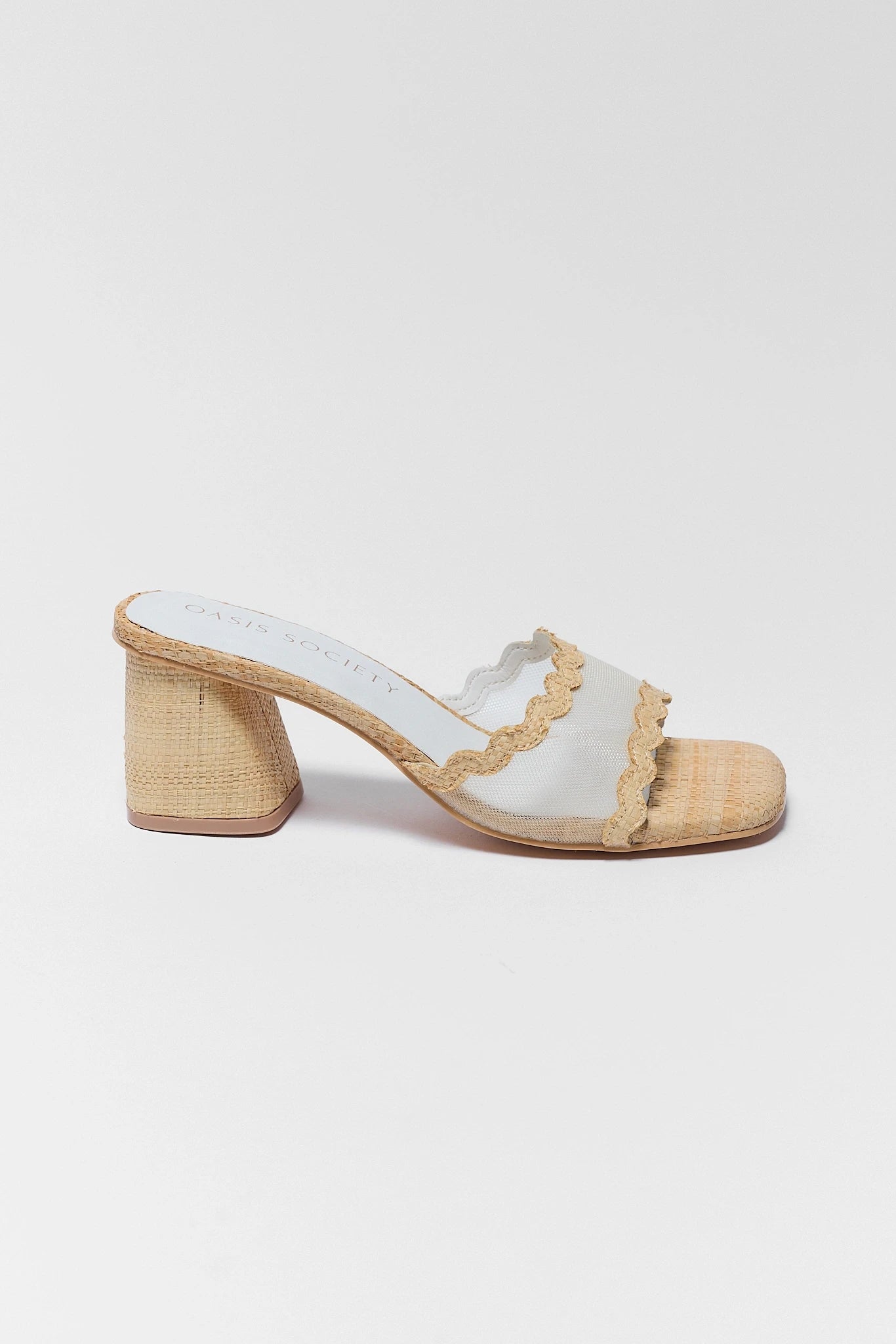 one White sandal with ruffled edge and beige woven sole on a white background