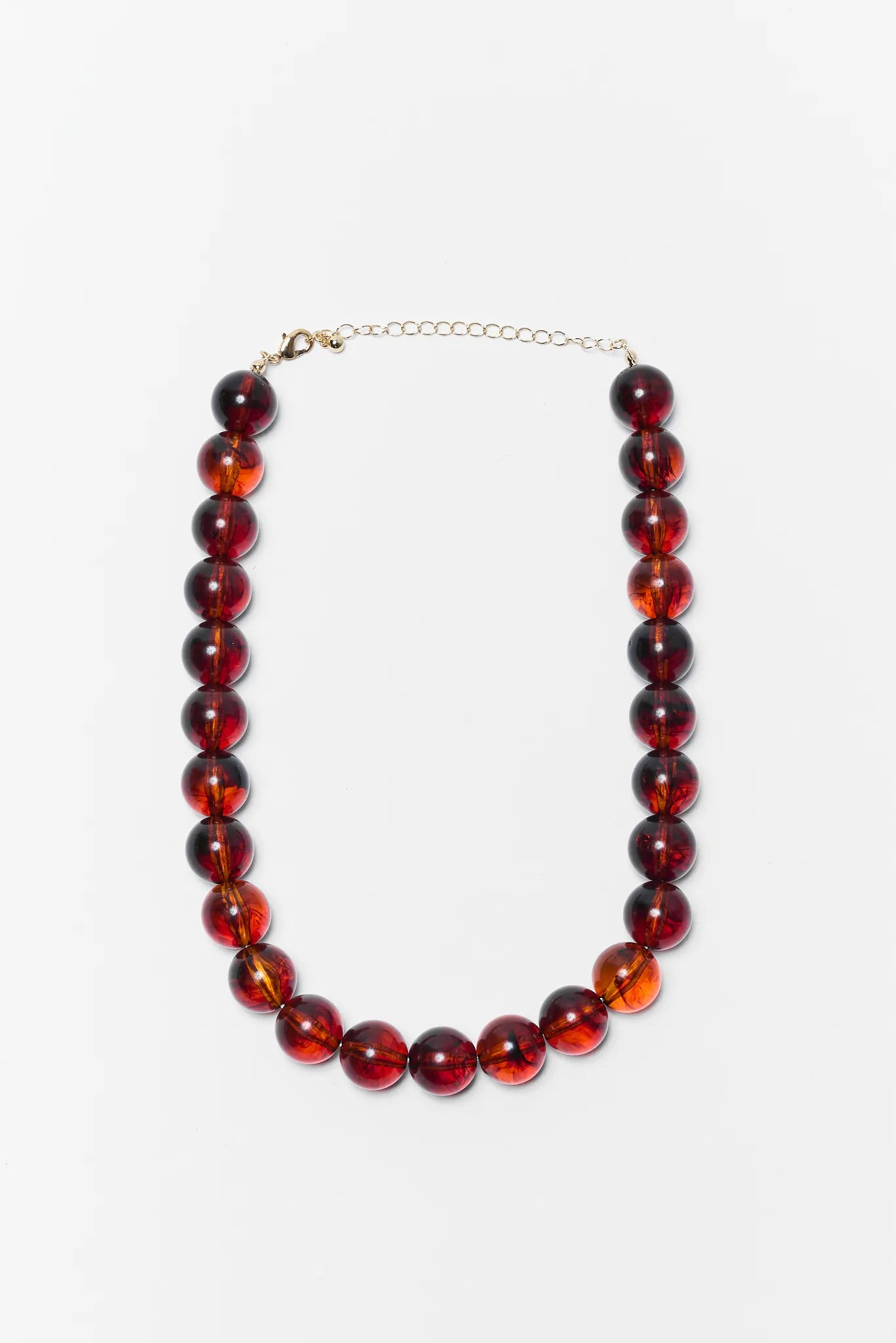 Necklace with red beads on a white background