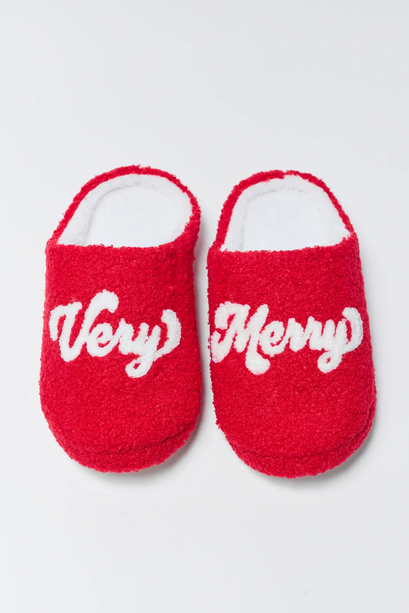 Very Merry Fuzzy Slippers on a white background