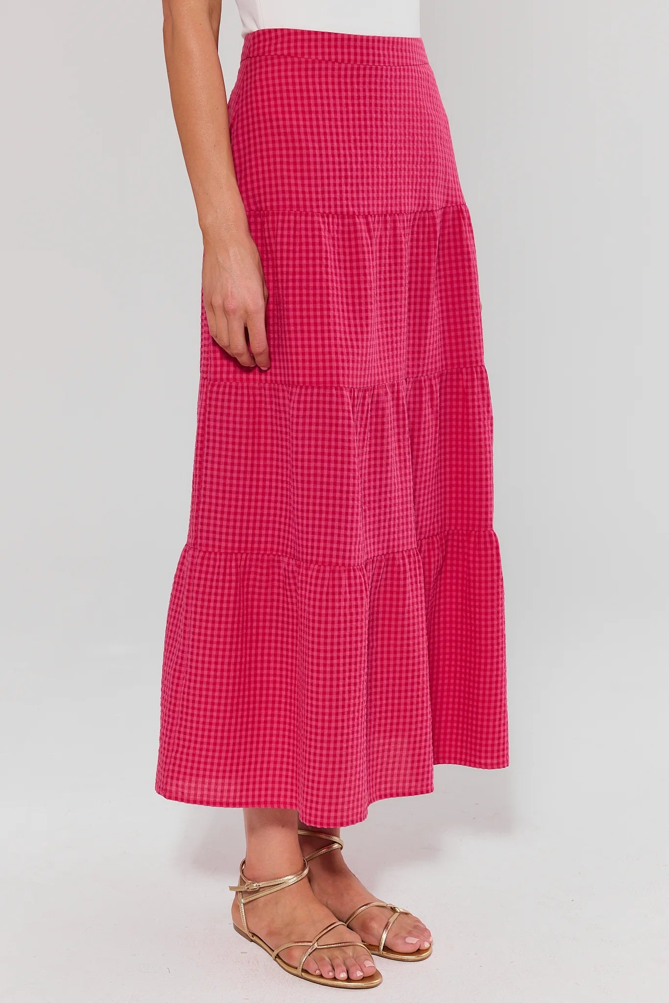 side shot Red checkered skirt worn by a person on a white background
