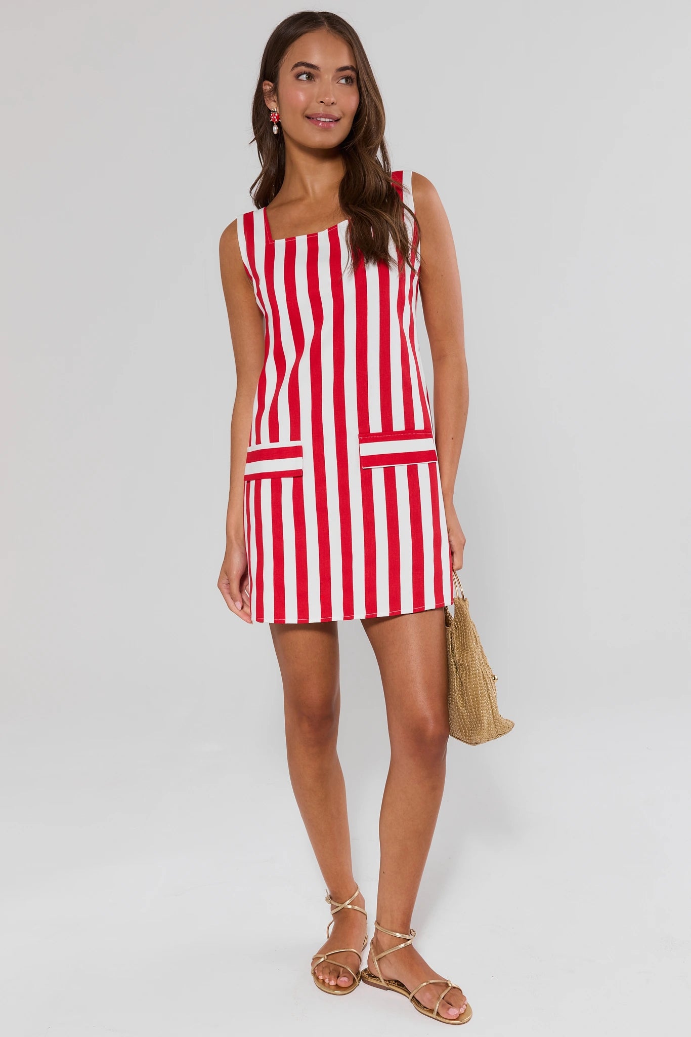 Woman wearing a red and white striped dress on a background