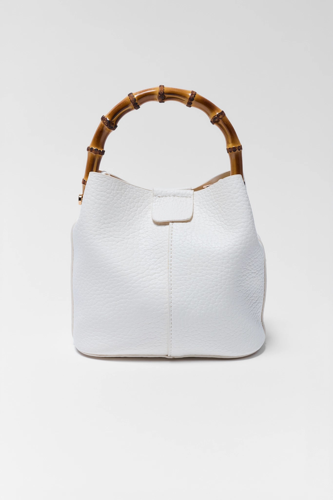 White handbag with wooden handle on a white background