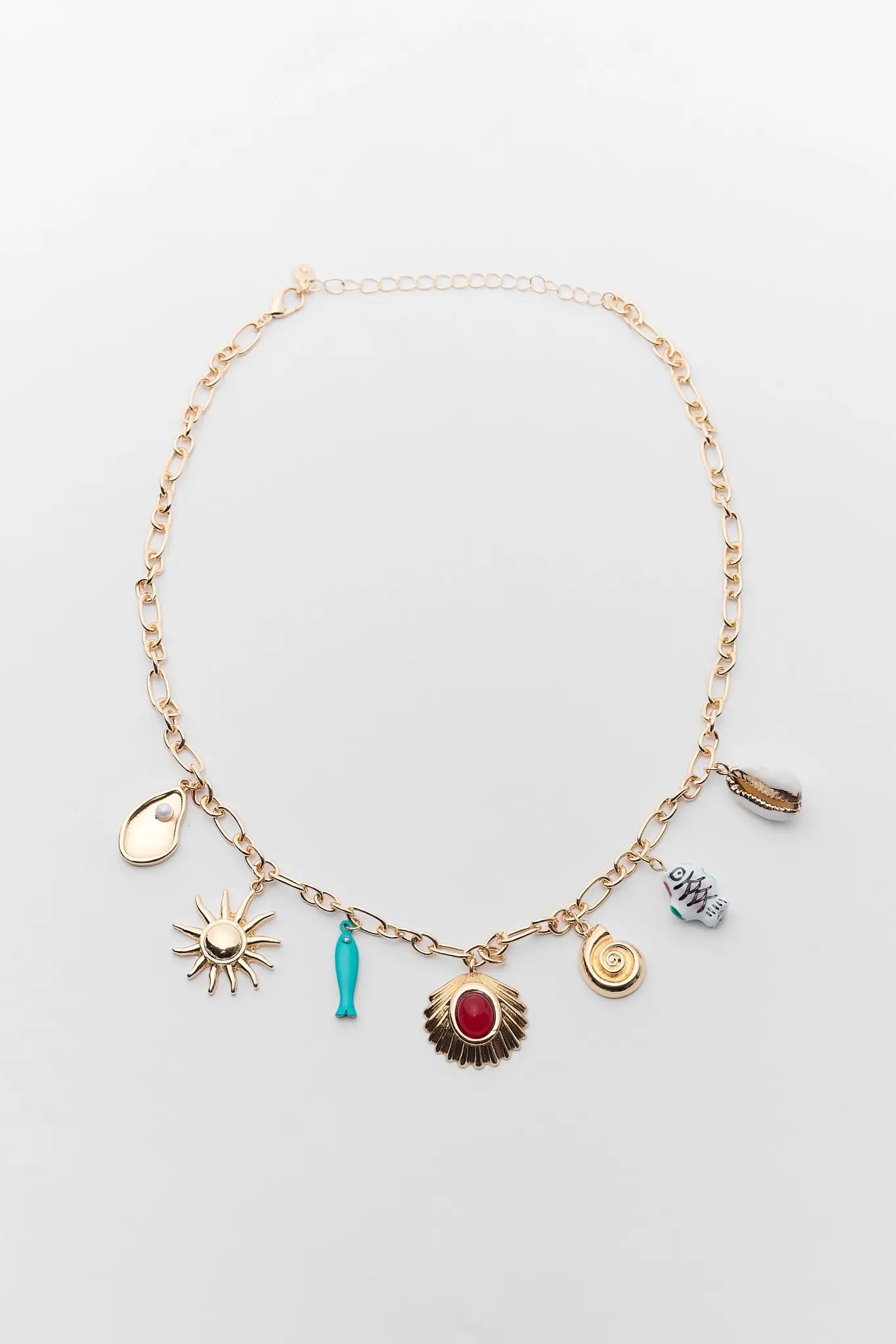 Necklace with various charms on a light gray background