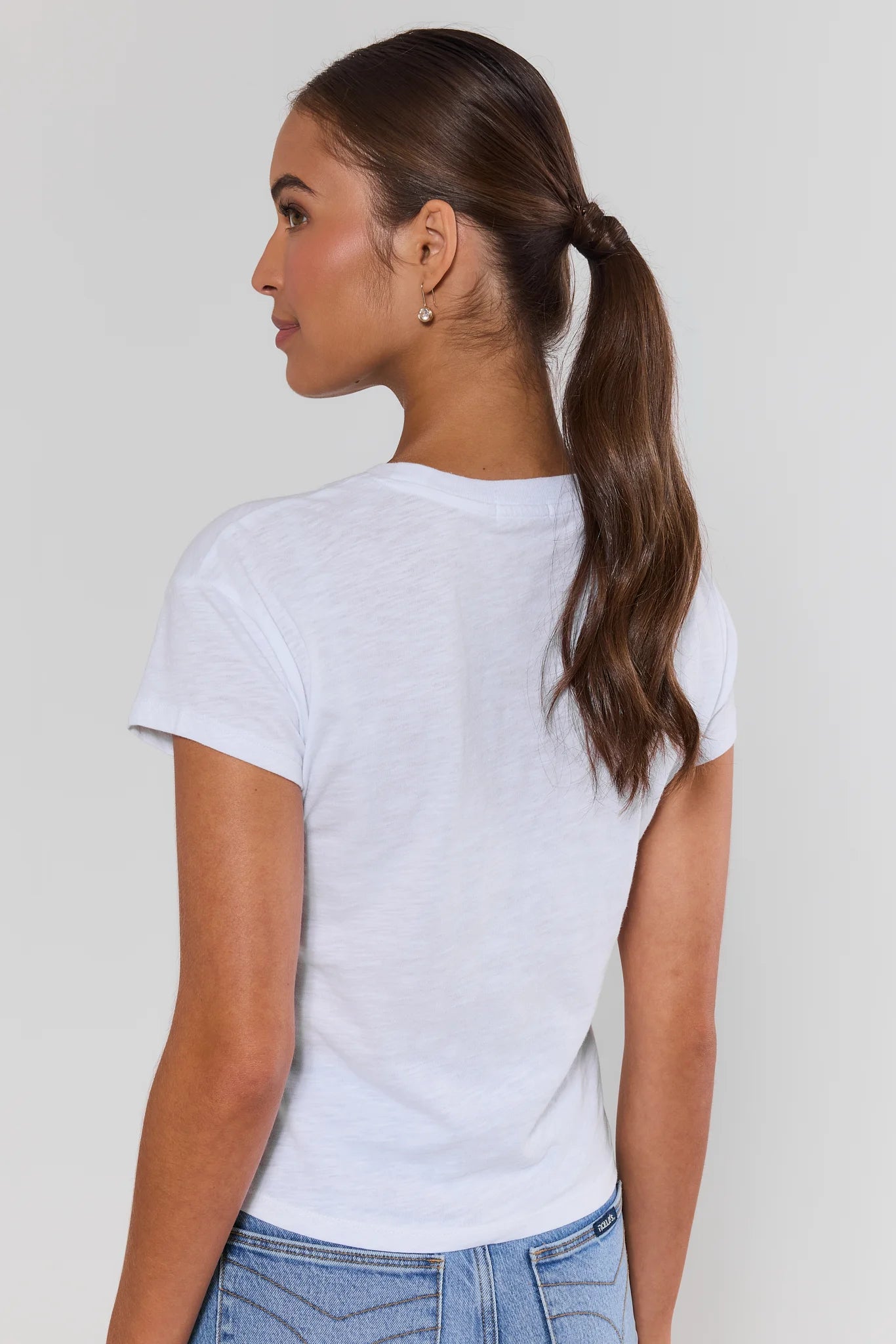 woman wearing white modern slub tee on a white background standing