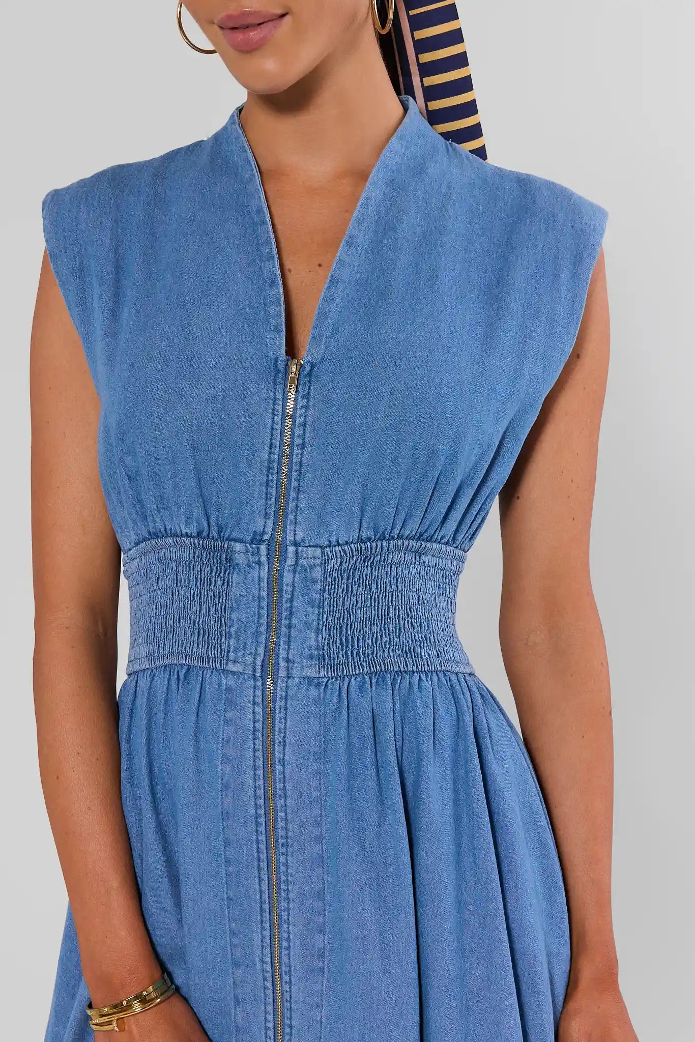 close up woman wearing collins medium wash dress on white background