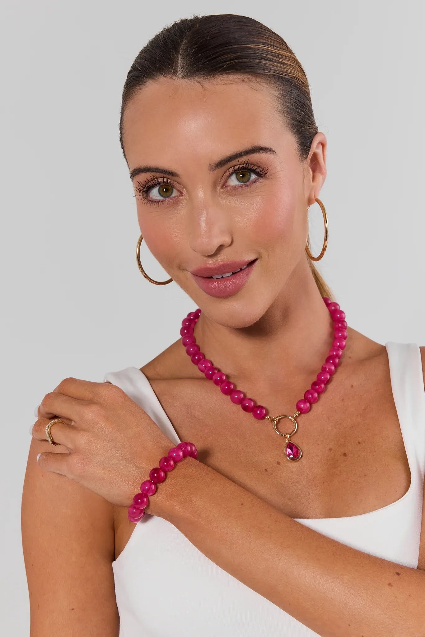 woman wearing matching Pink Stone Stretch Bracelet and necklace