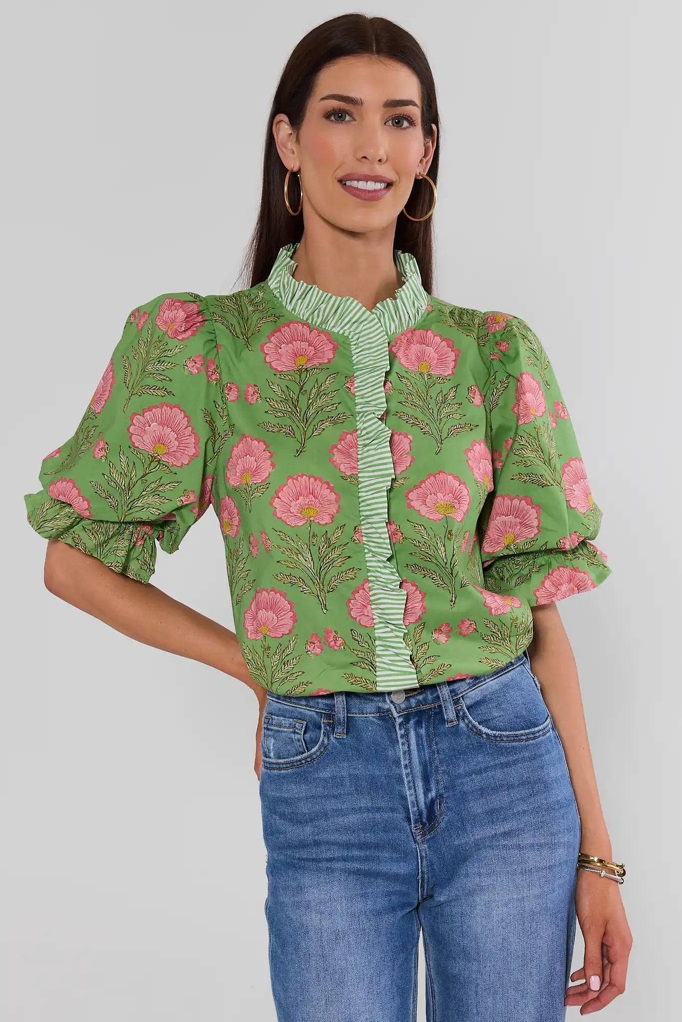 Woman wearing Green Floral Print Contrast Trim Top with jeans on a white background