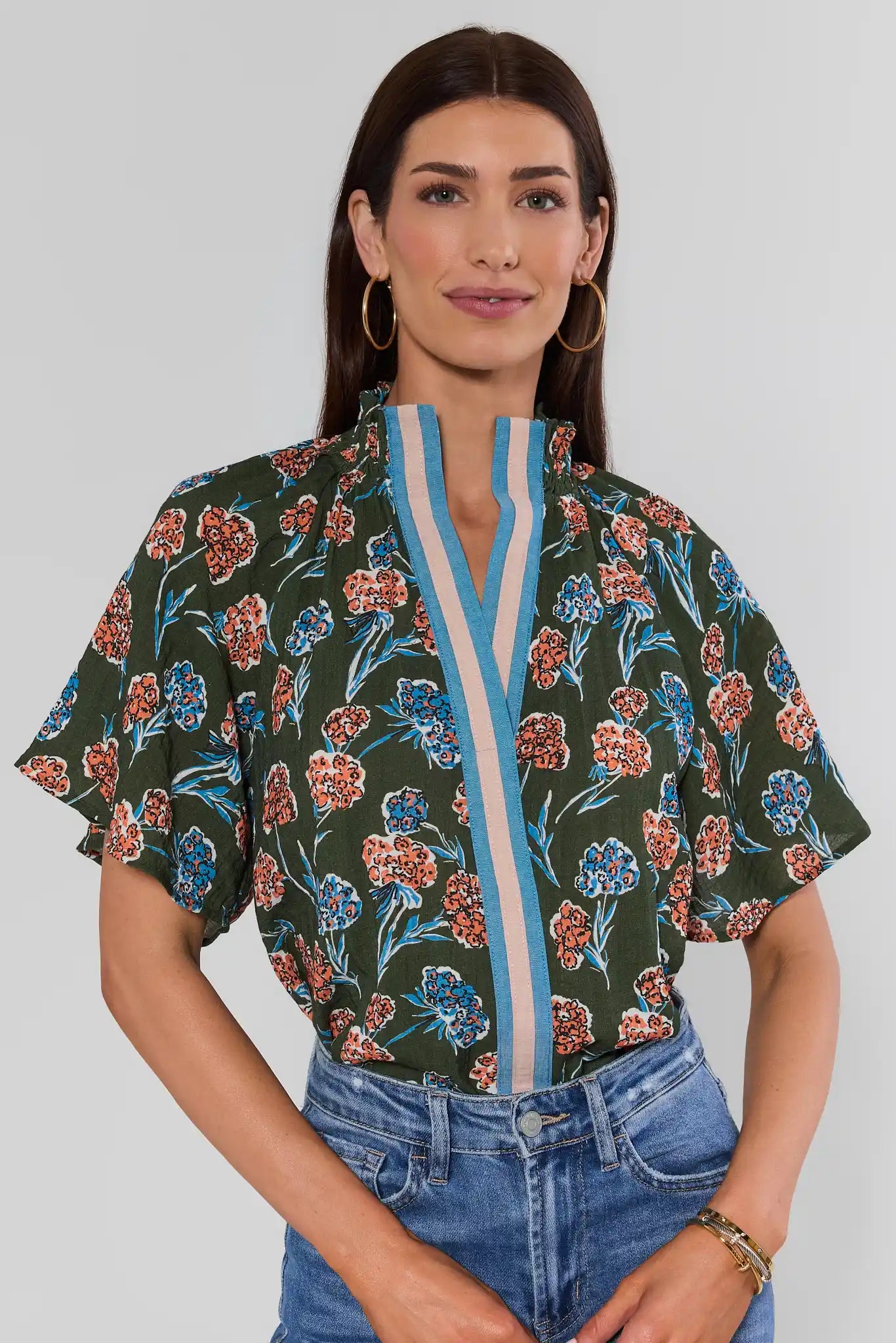 Woman wearing Macey Forest Green Floral Top by THML on a white background