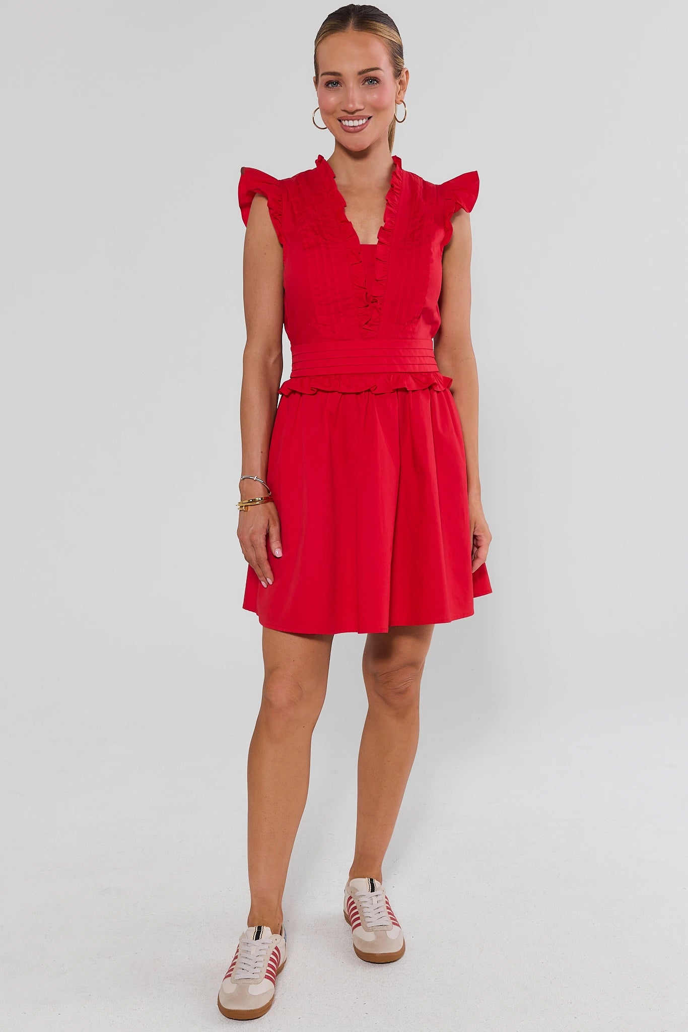 Woman wearing Makayla Red Flutter Sleeve Short Dress on a white background standing