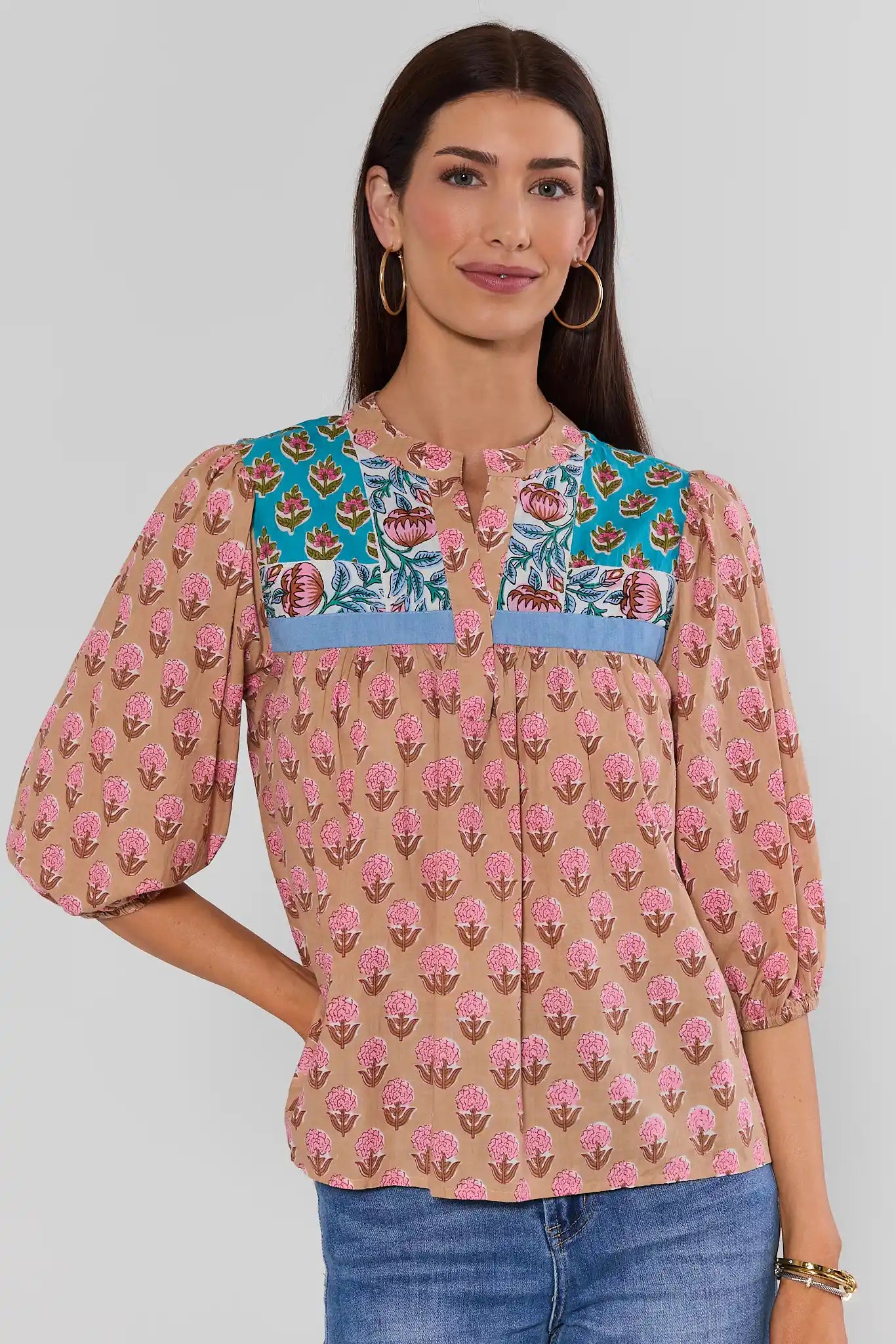 Woman wearing Multi Printed Split Neck Top by THML on a white background
