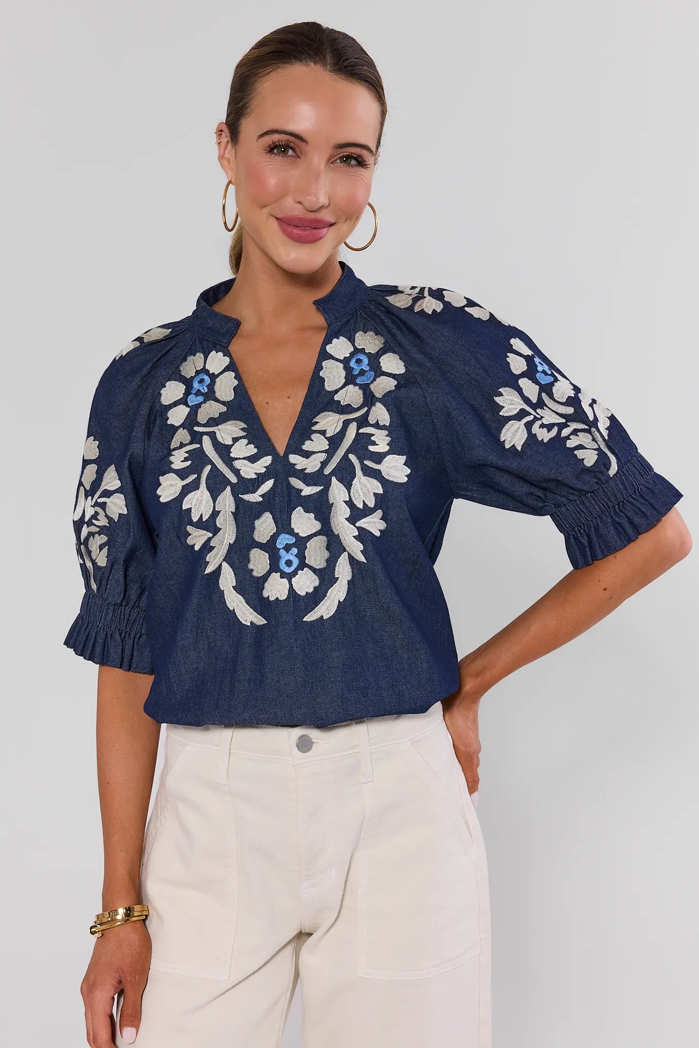 Woman wearing Navy Floral Embroidered Top by THML on a white background