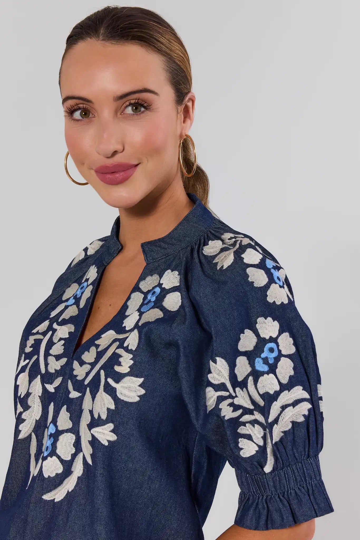 close up Woman wearing Navy Floral Embroidered Top by THML on a white background