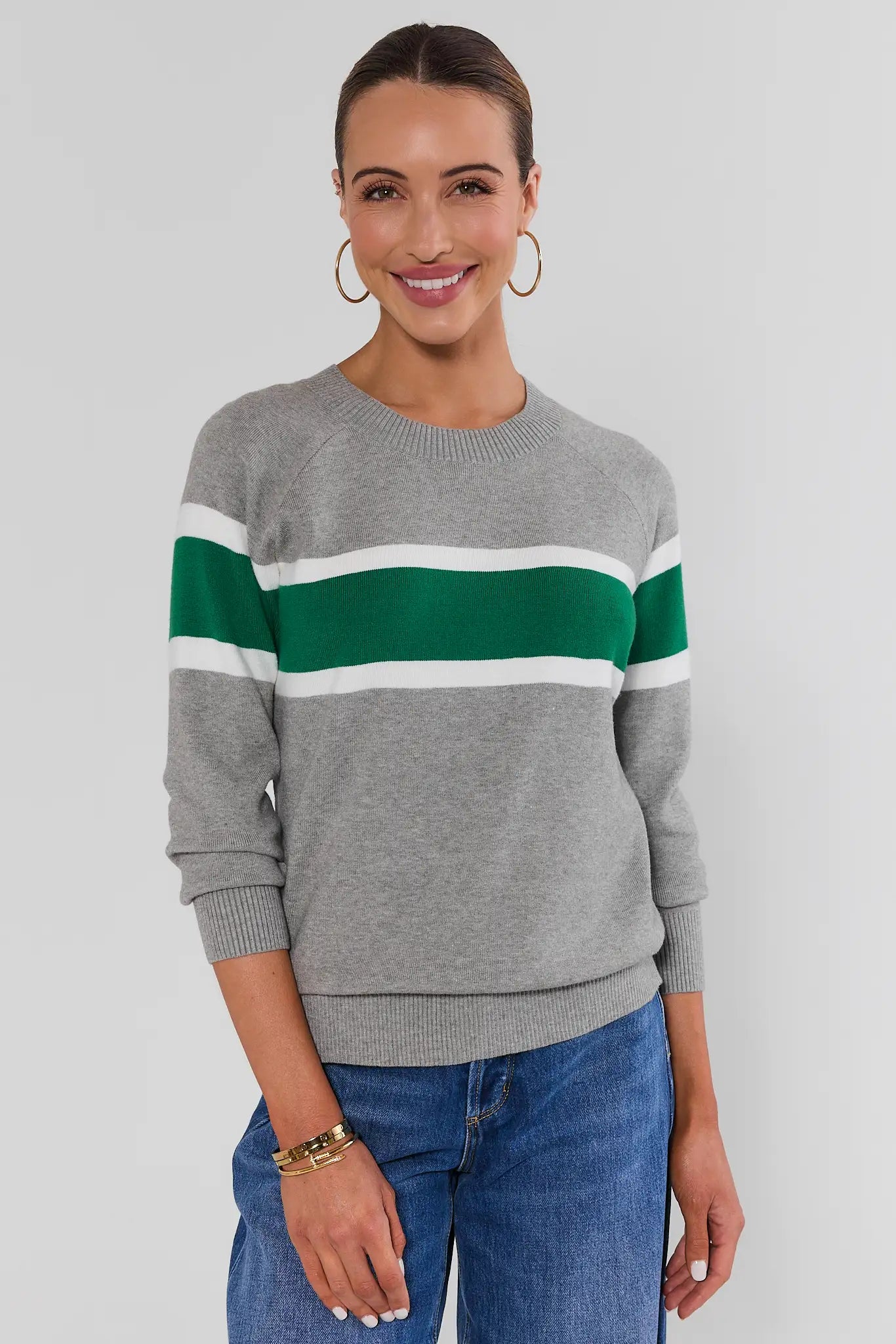 Woman wearing Dylan Green Stripe Sweater on a white background