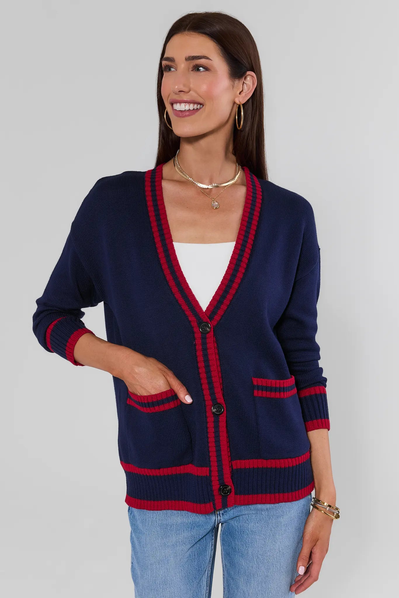 Woman wearing Navy Contrast Trim Applique Cardigan with pockets on a white background