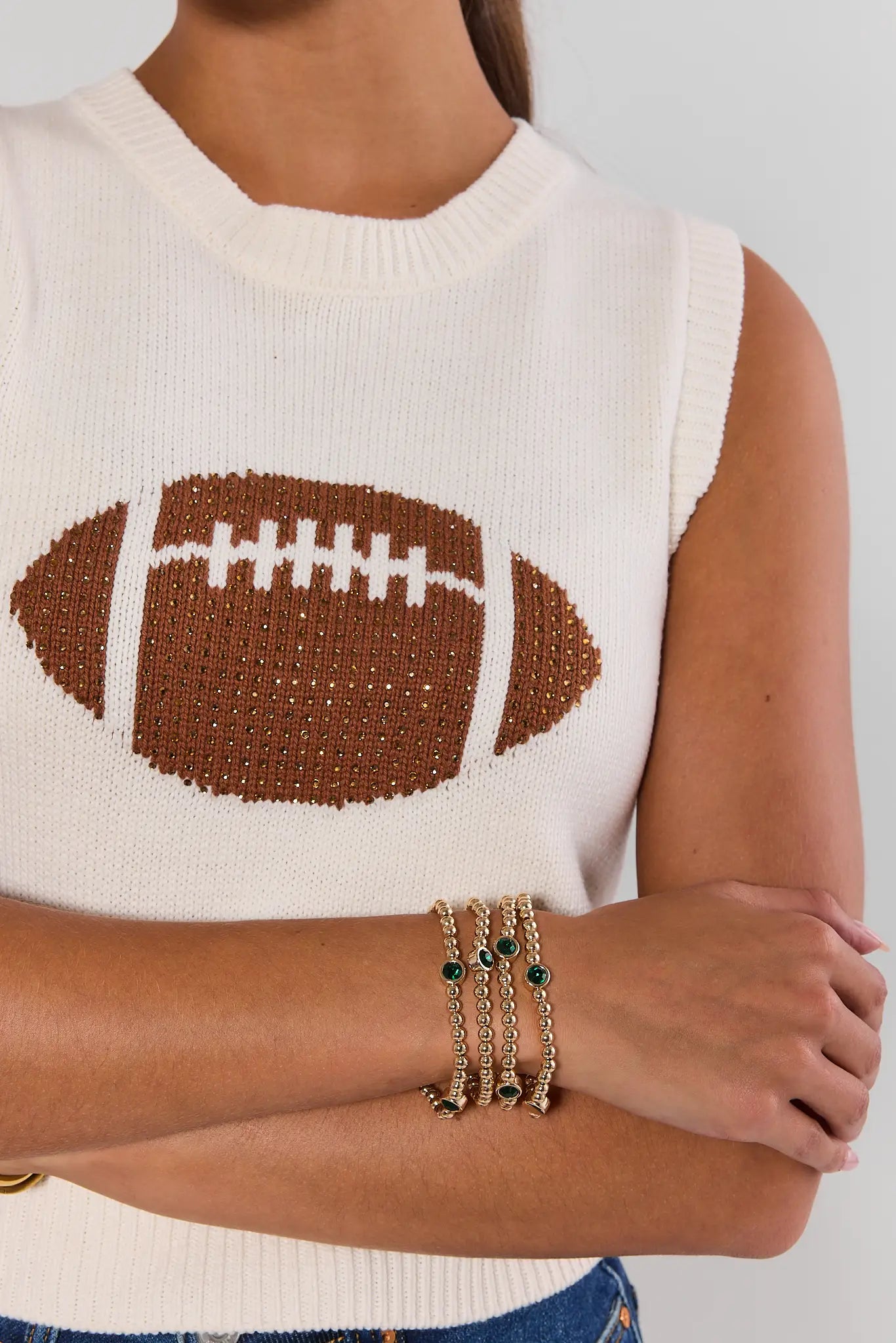 woman wearing Gold Beaded green Rhinestone Bracelets on a white background