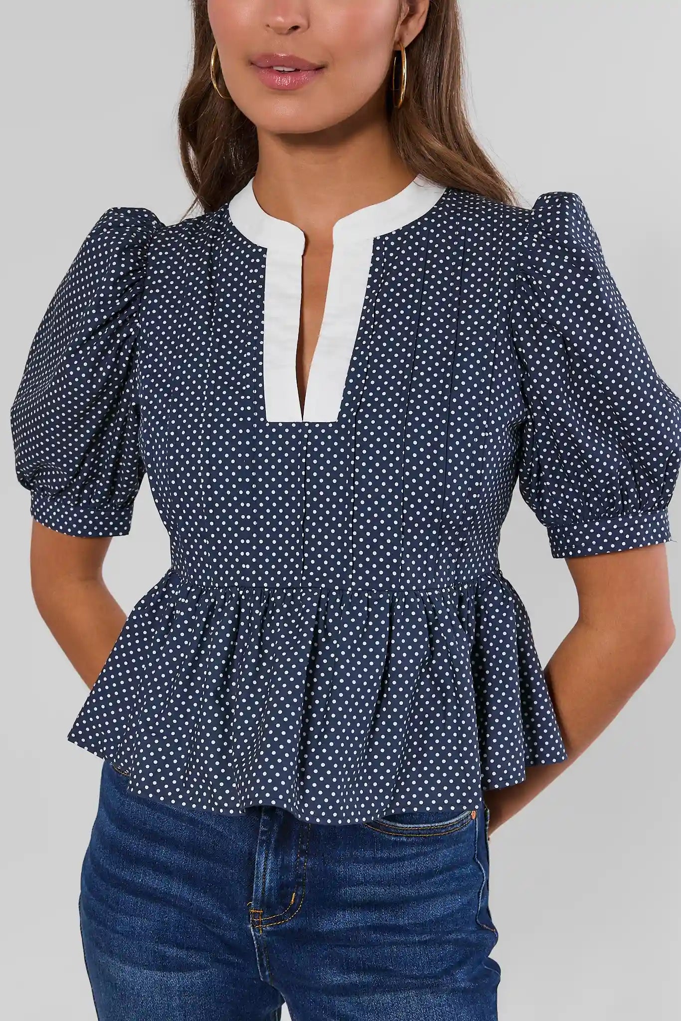 Navy Polka Dot Peplum Top
