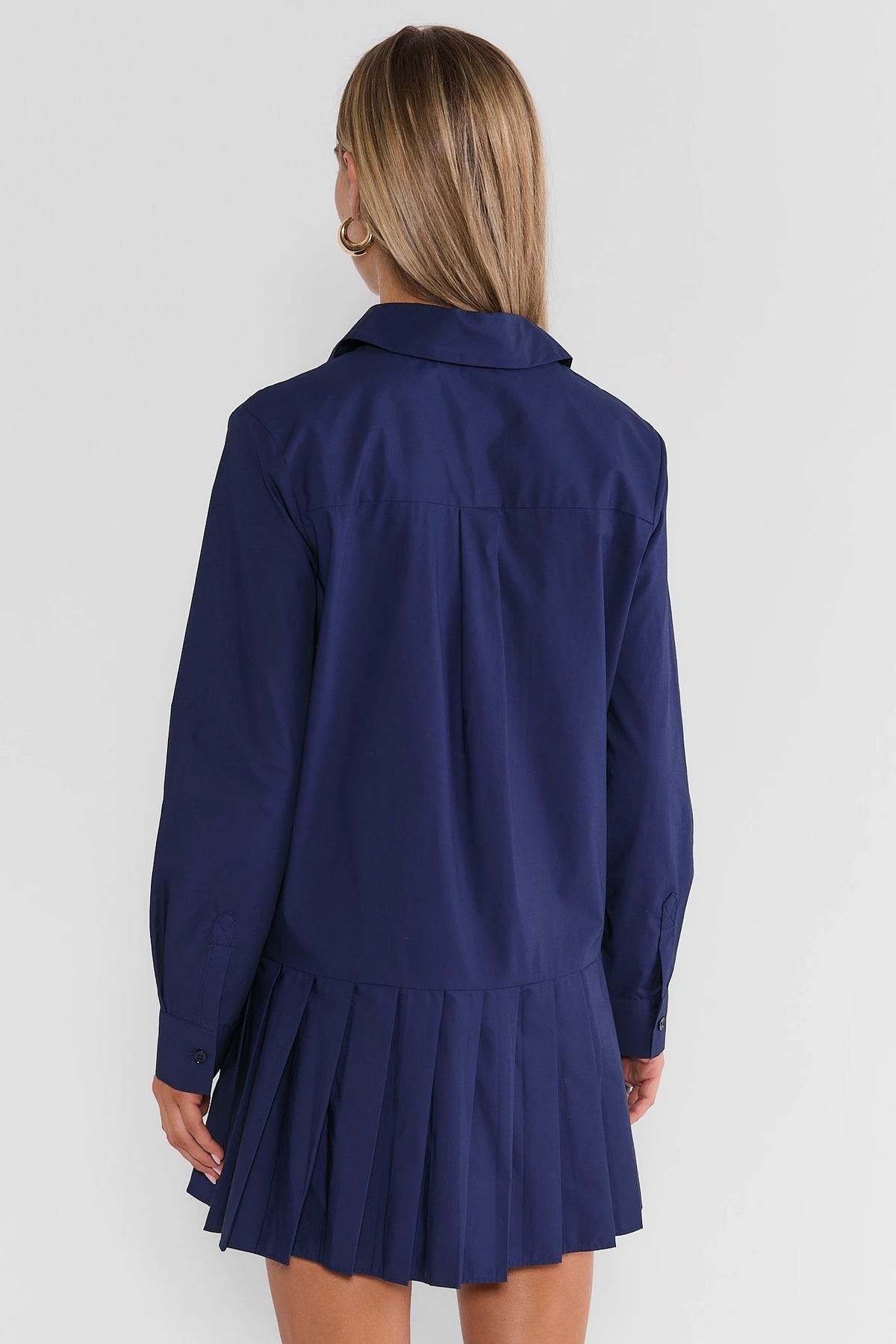 Navy Pleated Skirt Short Dress - Back View On Model | Avara