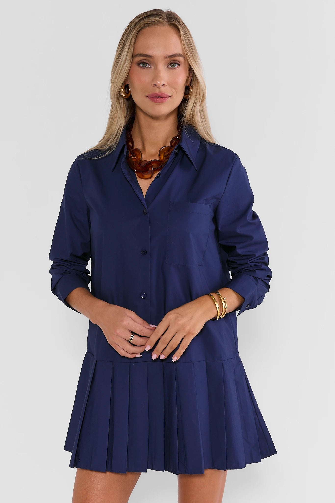 Navy Pleated Skirt Short Dress - Front View On Model | Avara