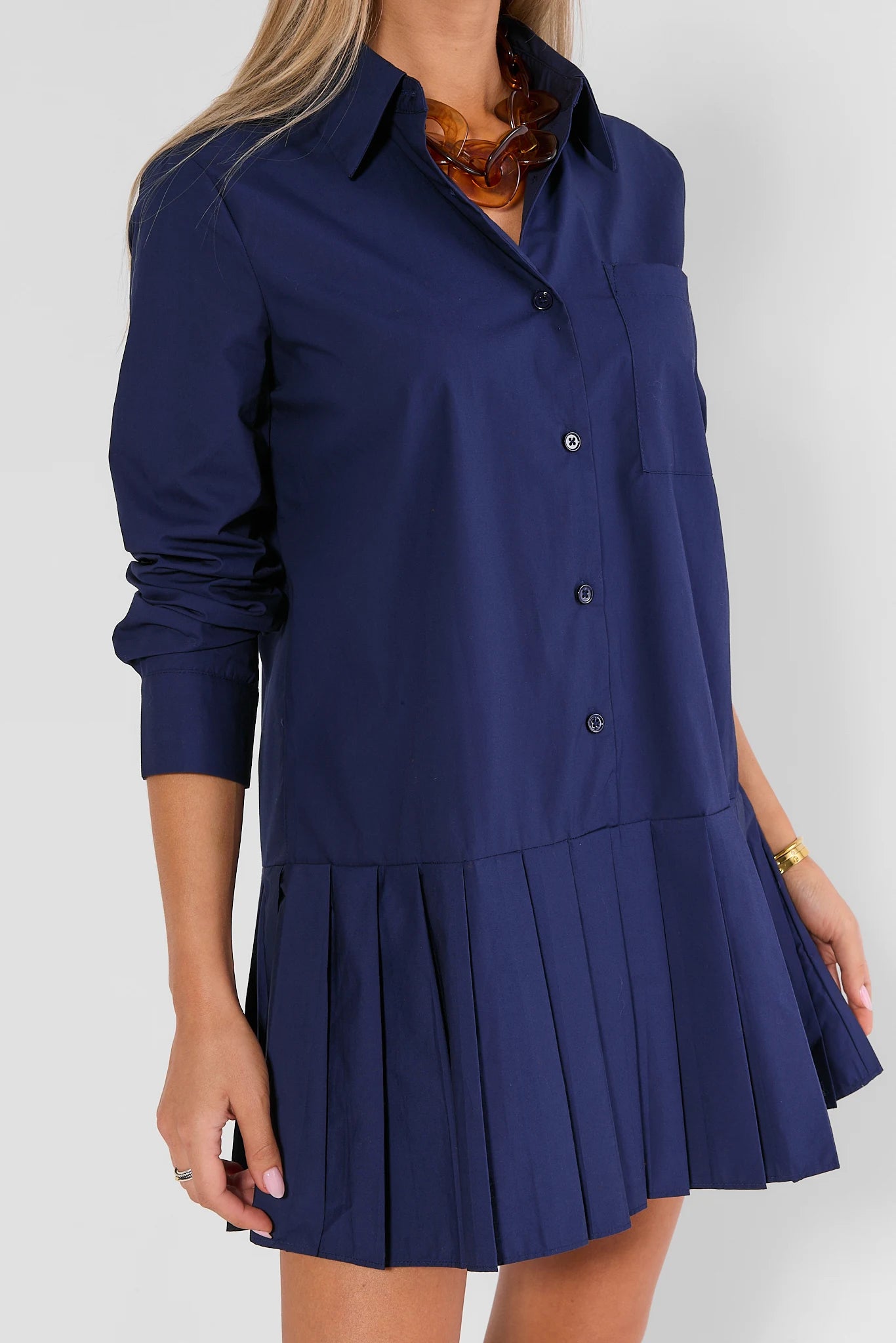 Navy Button-Up Short Dress with Pleated Skirt - Side Detail On Model | Avara