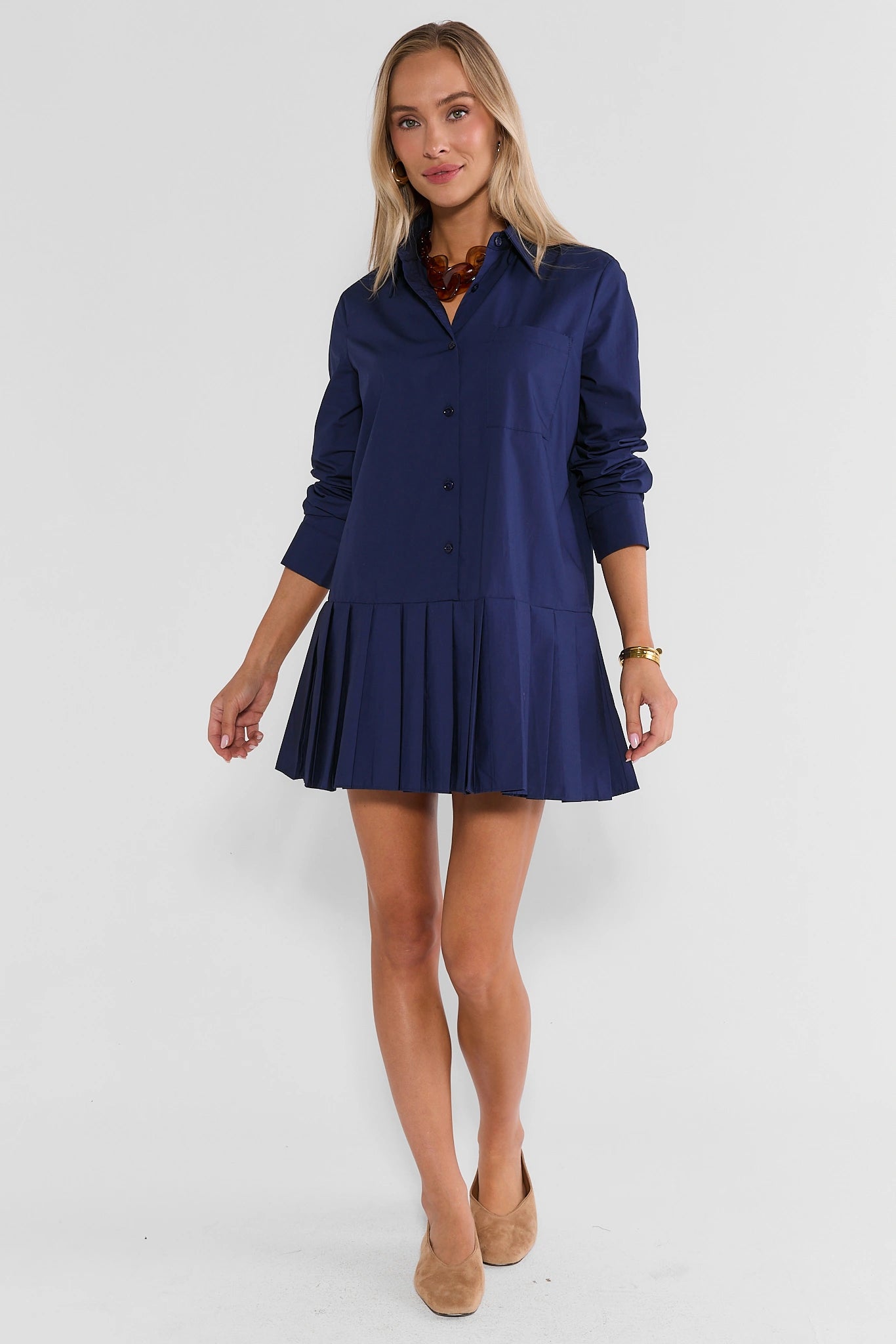 Navy Pleated Skirt Short Dress Full Length On Model with Tan Kitten Heels | Avara