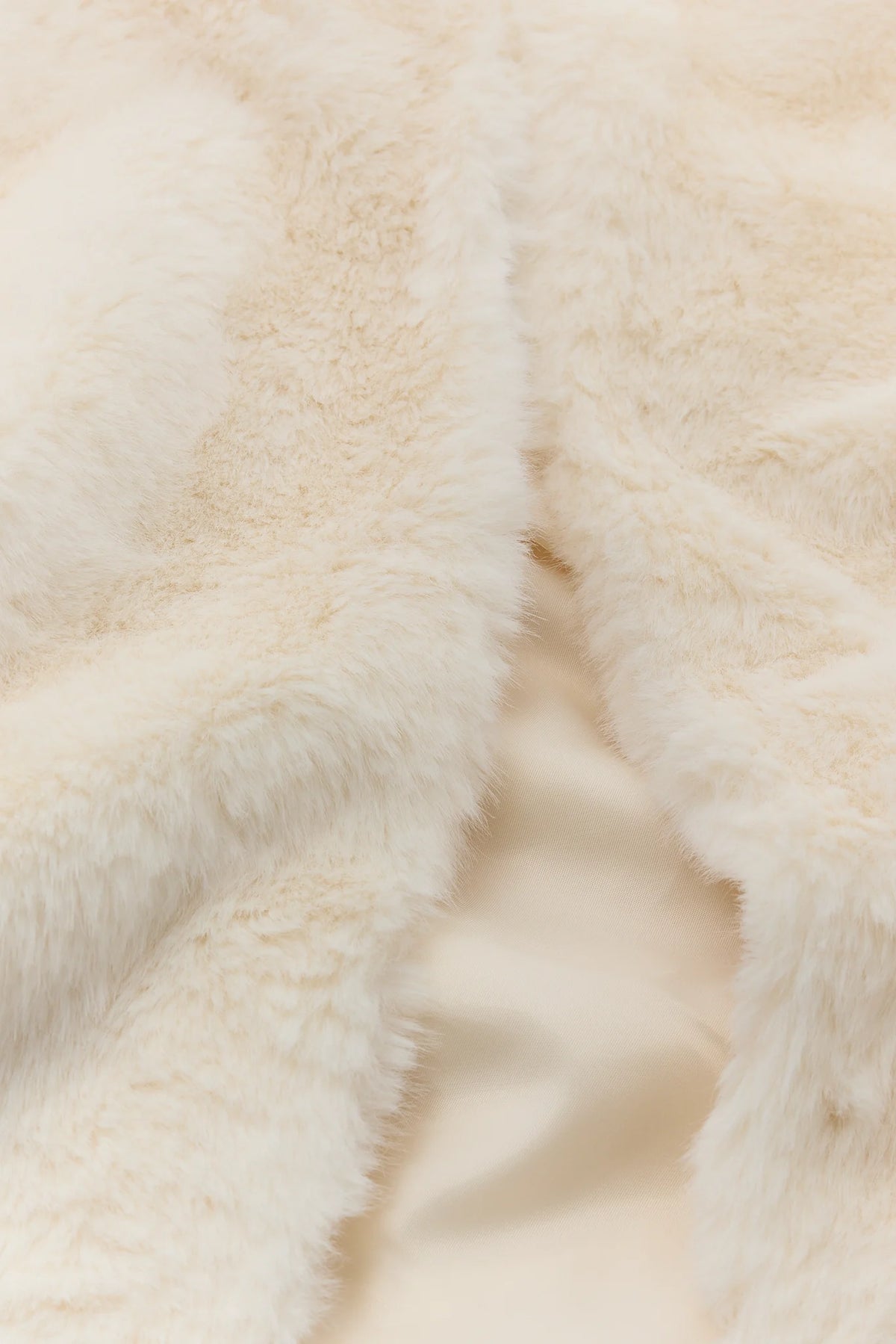 Ivory Faux Fur Collarless Jacket - Side Profile On Model | Avara
