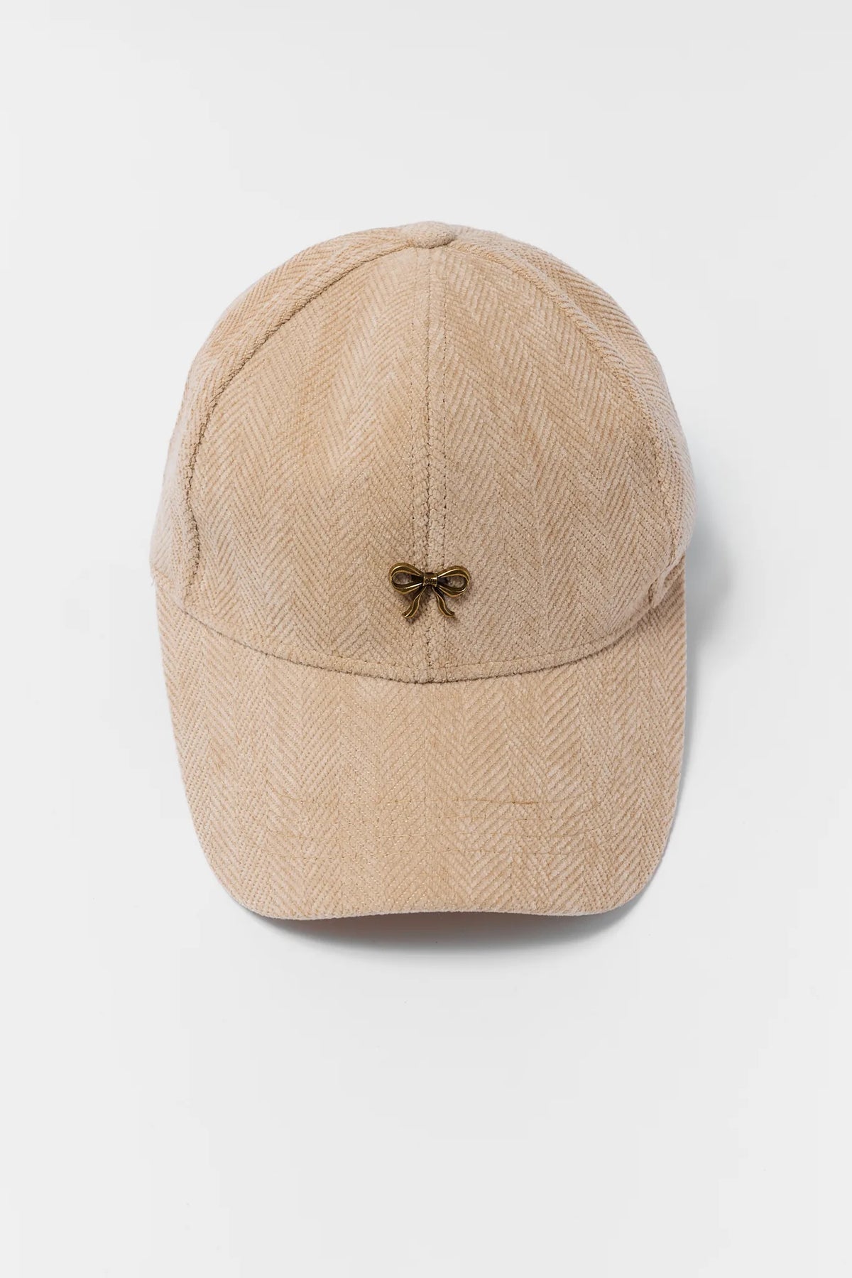 Tan Herringbone Textured Baseball Hat with Gold Bow Accent - Flat Lay | Avara