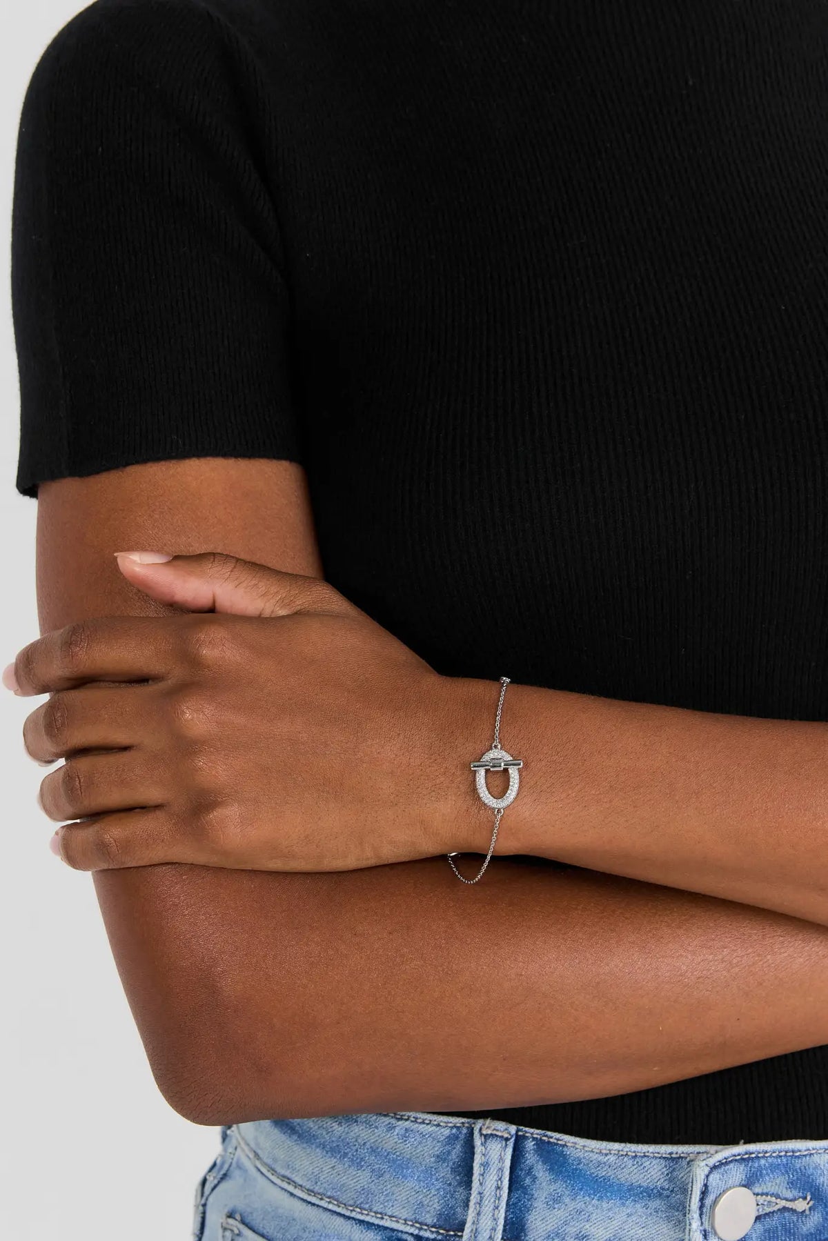 Silver Rhinestone Toggle Bracelet - On Model Wrist View with Black Knit Top | Avara