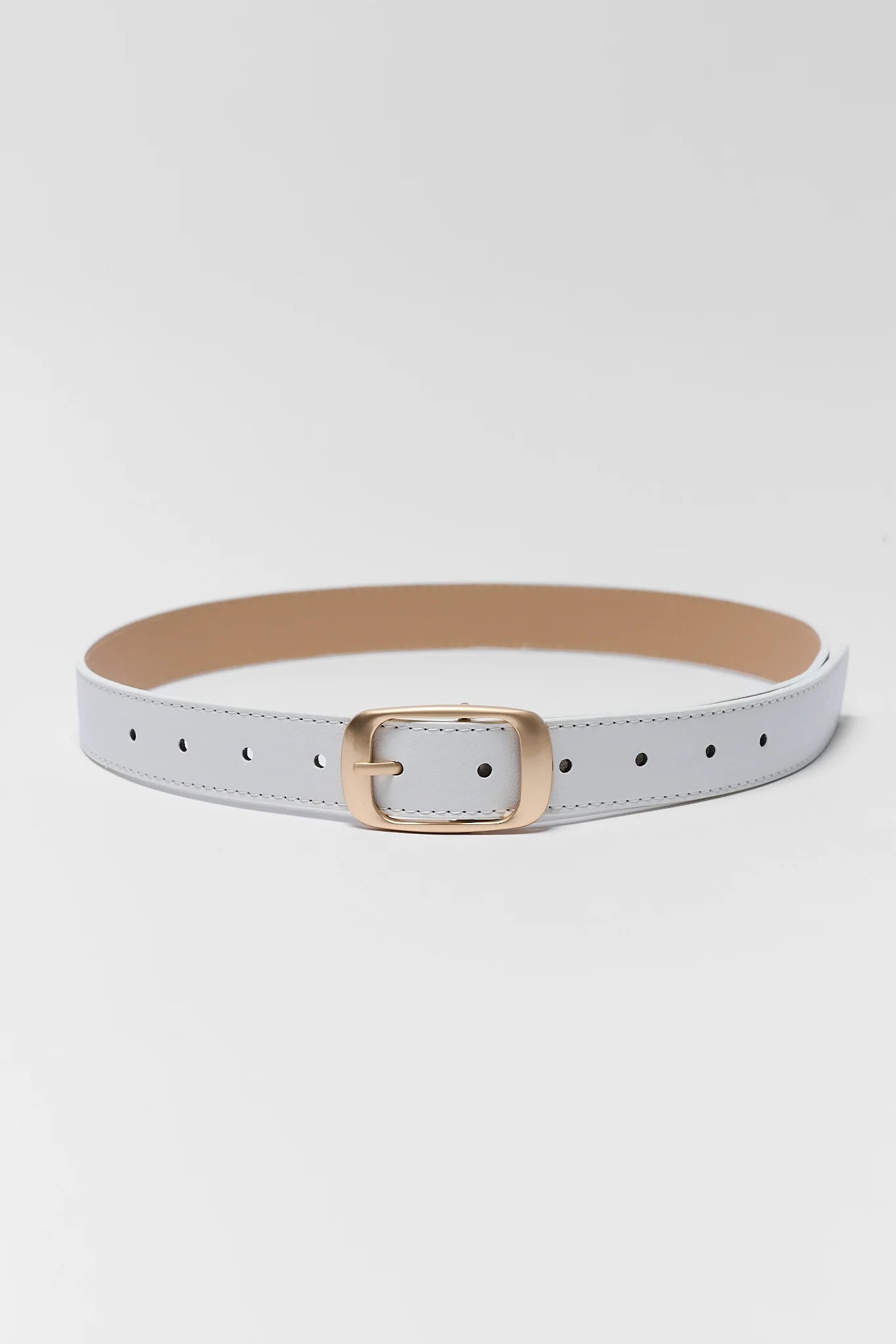 A slim light gray faux leather belt with a gold-tone metal buckle, displayed on a clean light gray background.