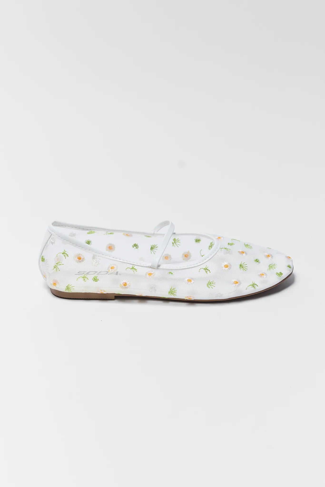 White loafers with floral pattern on a white background