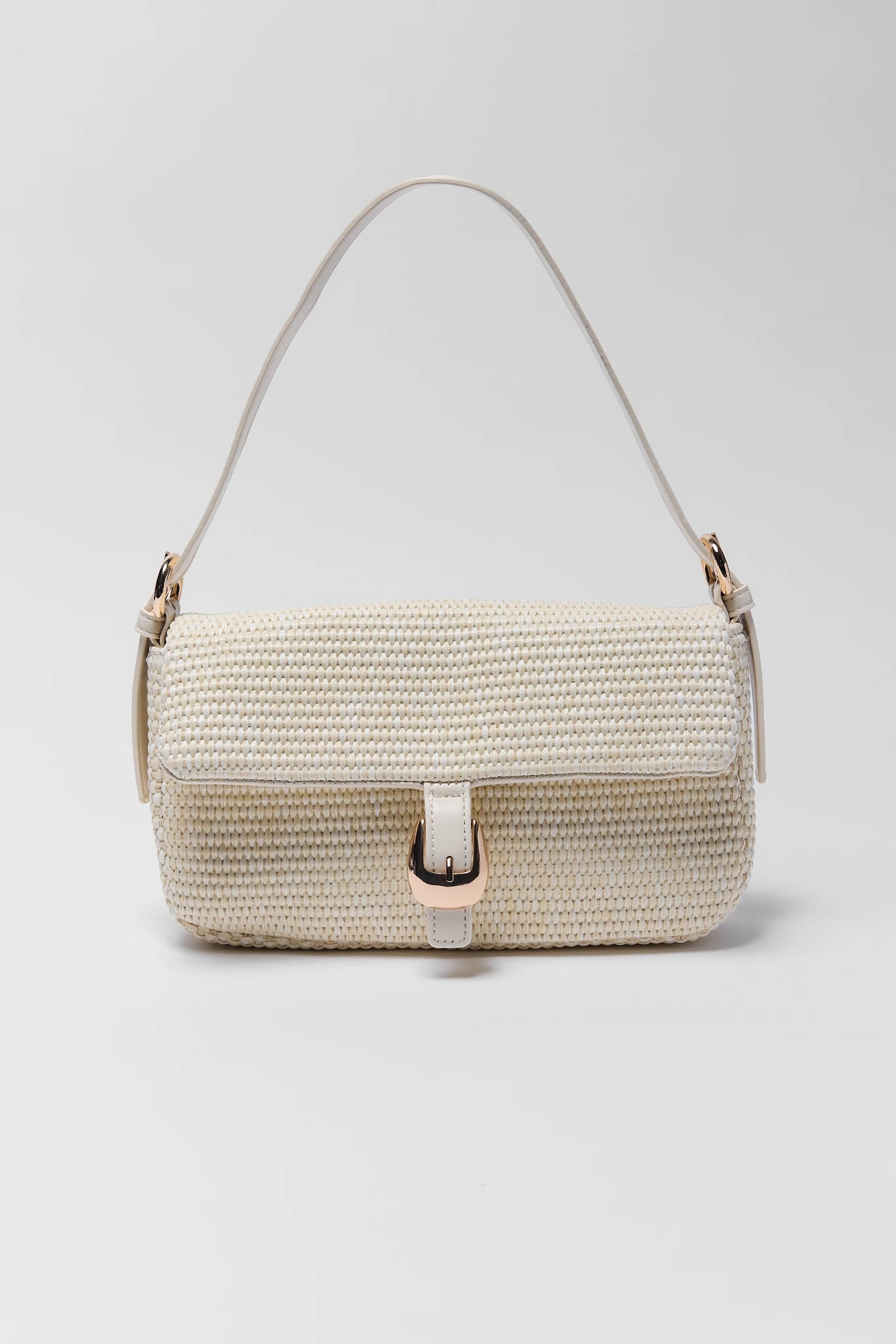 Woven handbag with a strap on a light gray background